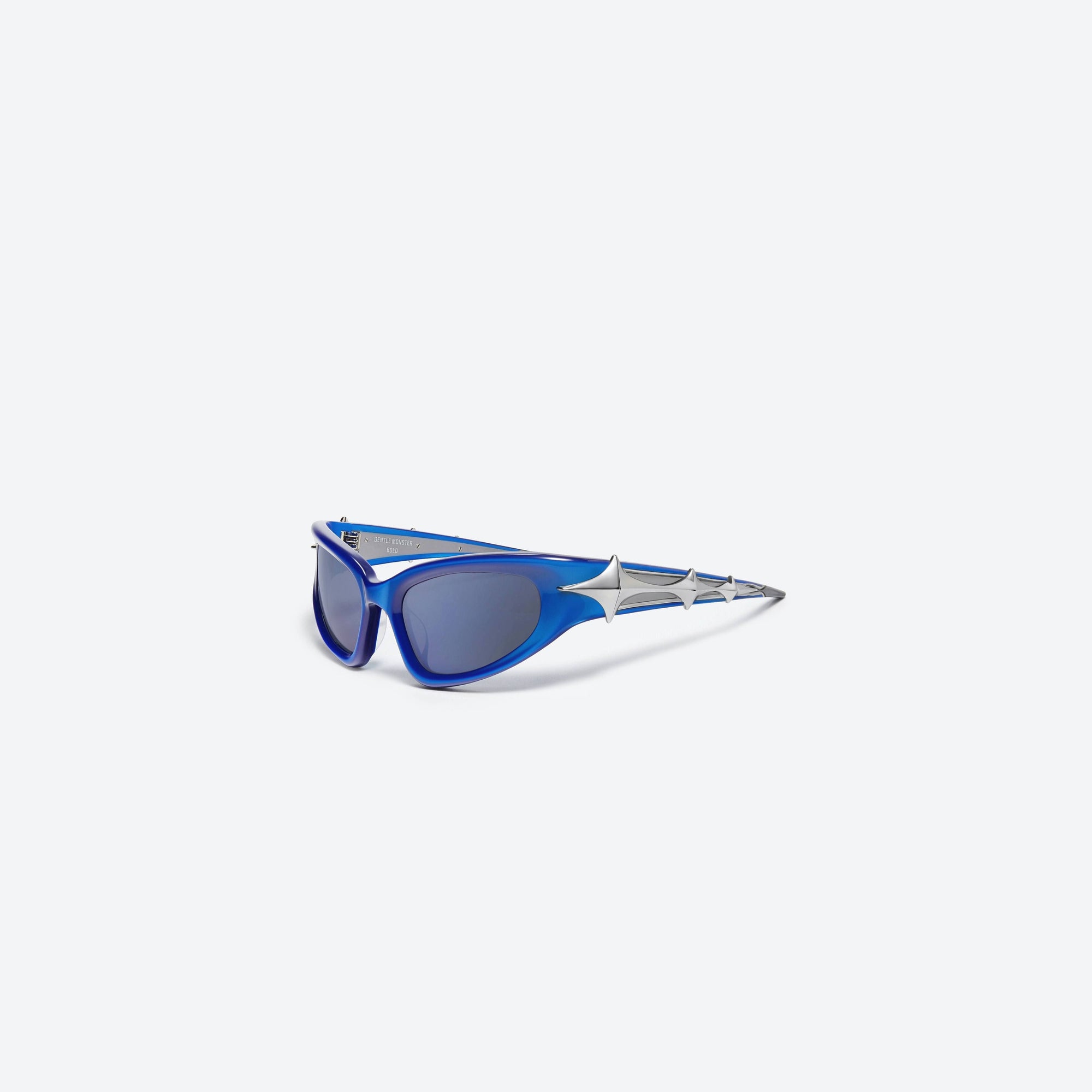 45-degree view of Gentle Monster Paso BL3 Blue Acetate framed Wraparound sunglasses.