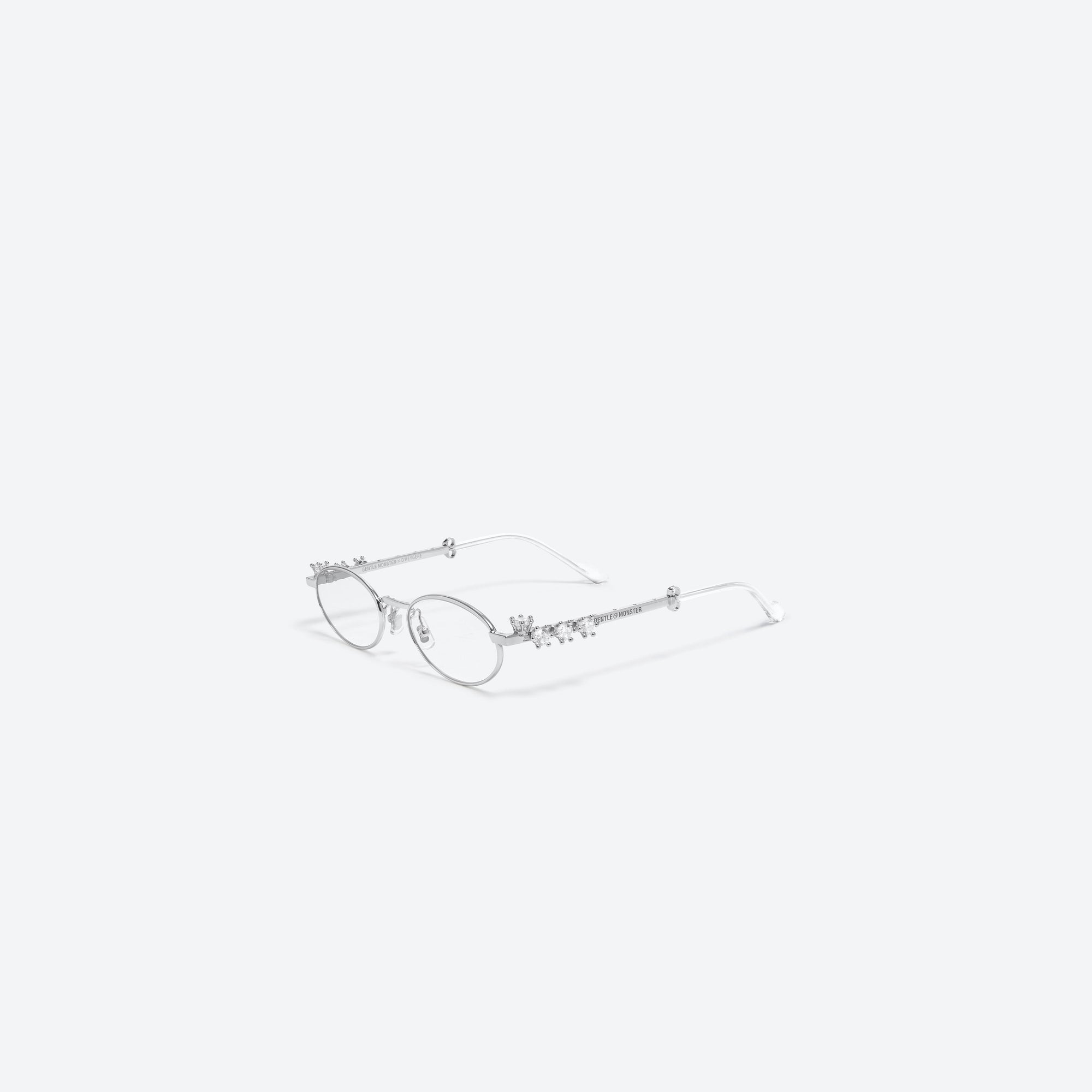 45-degree view of Gentle Monster D’heygere - Pierced 02 Silver Metal framed Oval sunglasses.