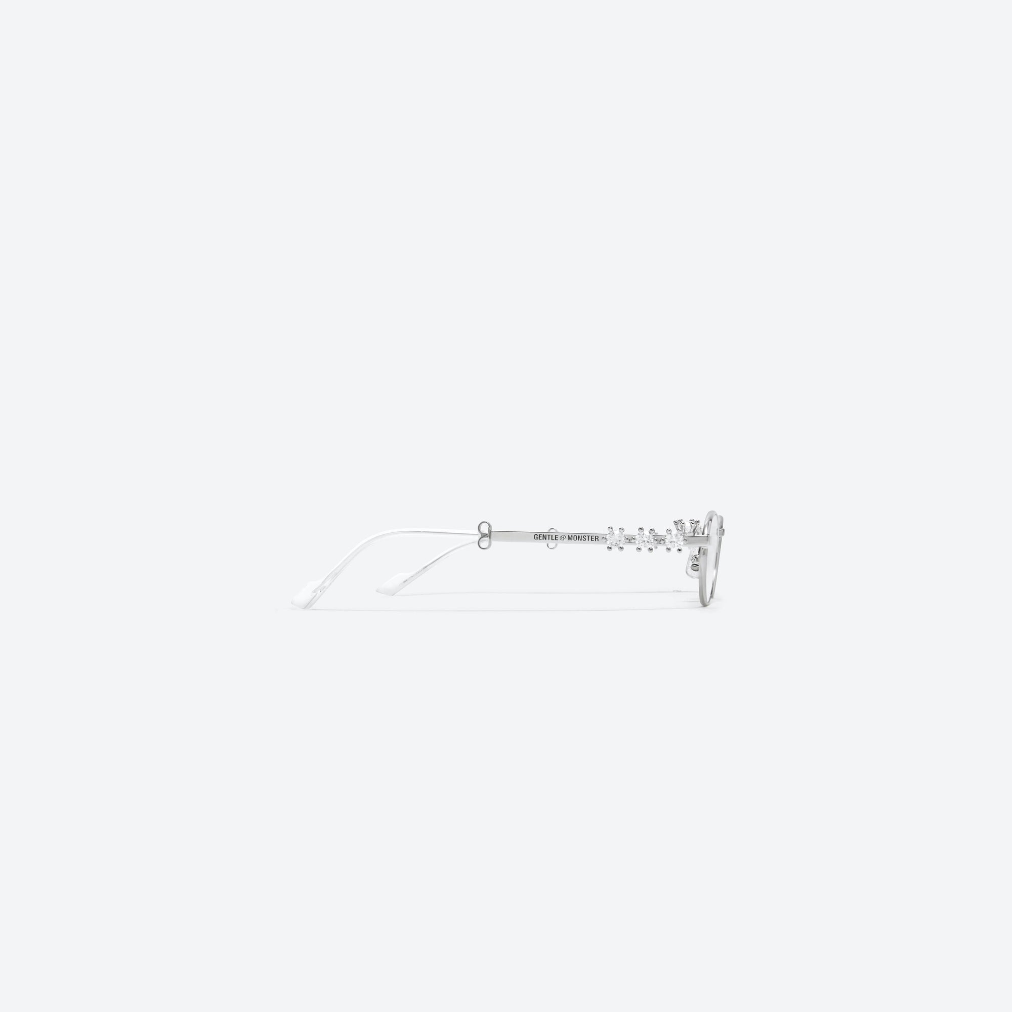 A detailed right view of Gentle Monster D’heygere - Pierced 02 Silver Metal framed Oval sunglasses.