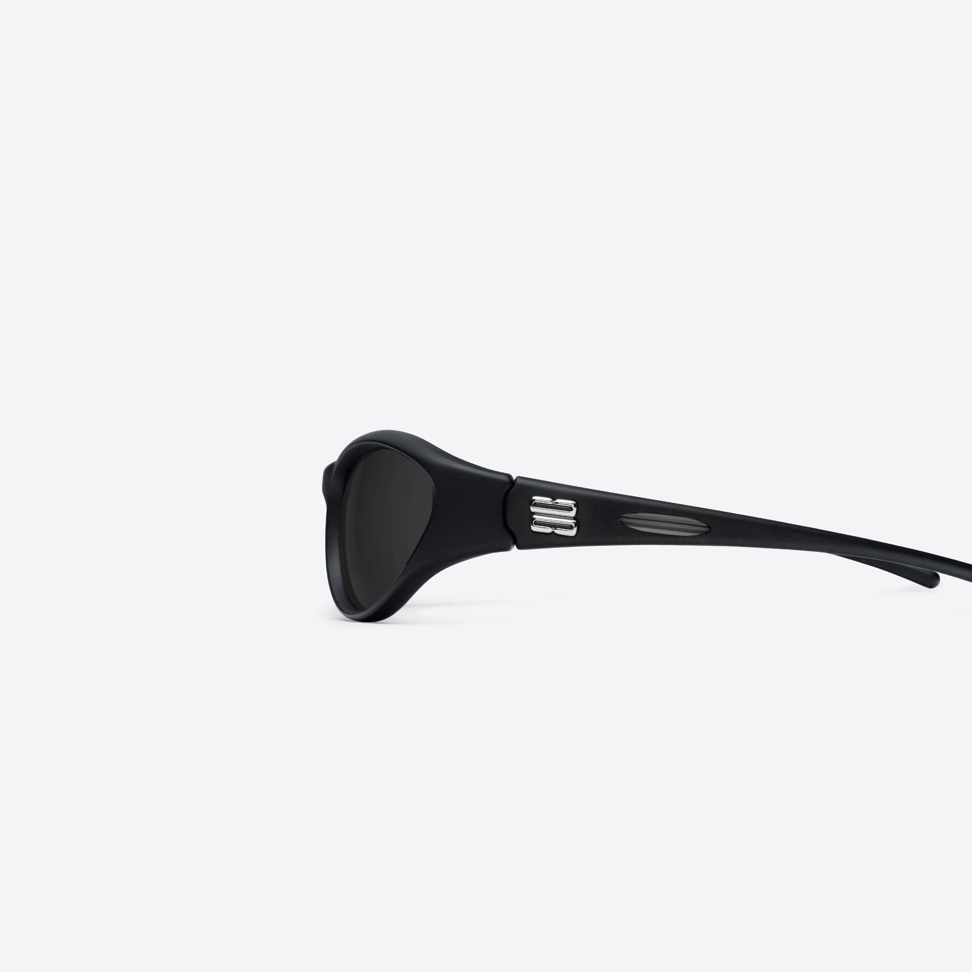 A detailed left view of Gentle Monster Sugar Buff 01 Black Nylon framed Wraparound sunglasses.