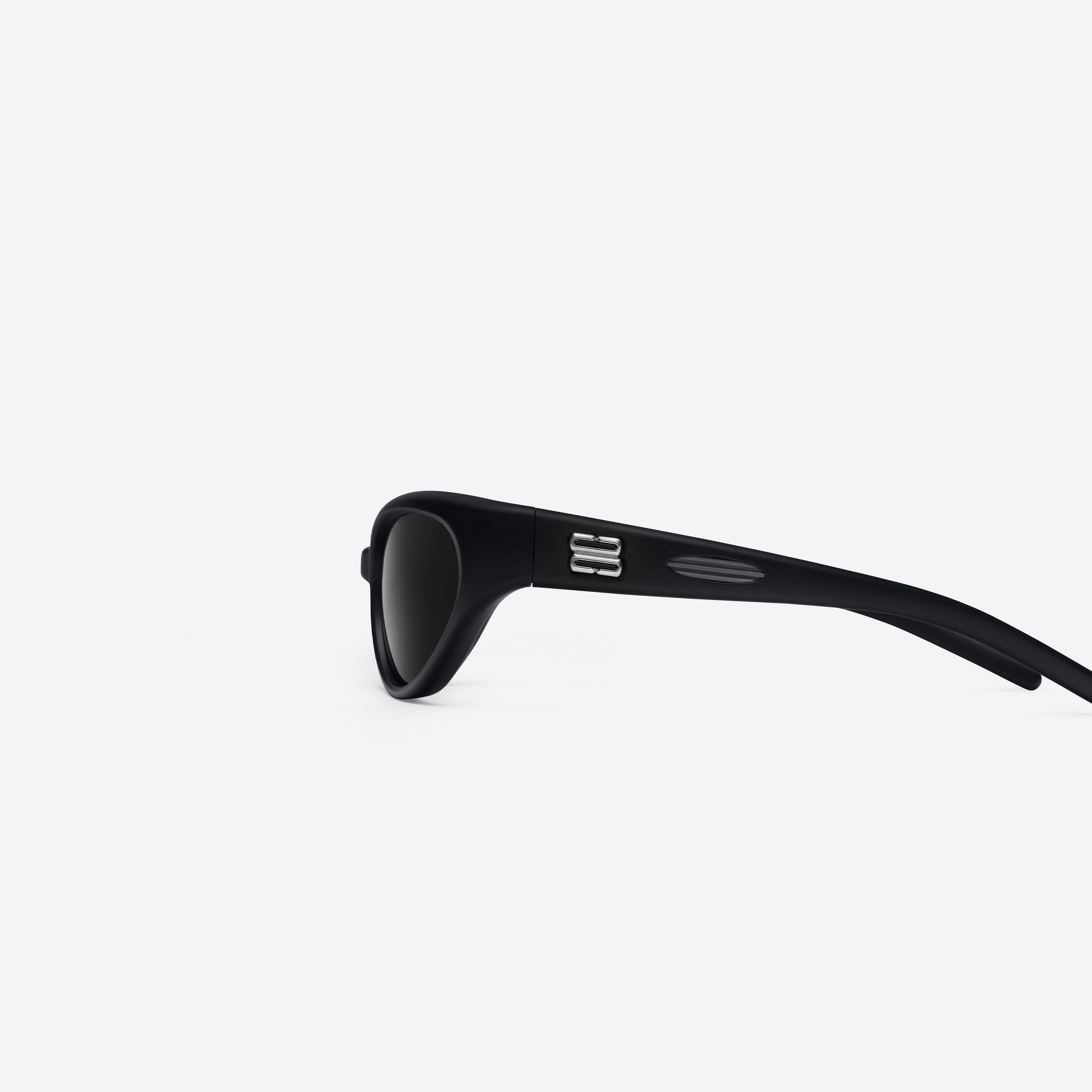 A detailed left view of Gentle Monster Juicy 01 Black Nylon framed Wraparound sunglasses.