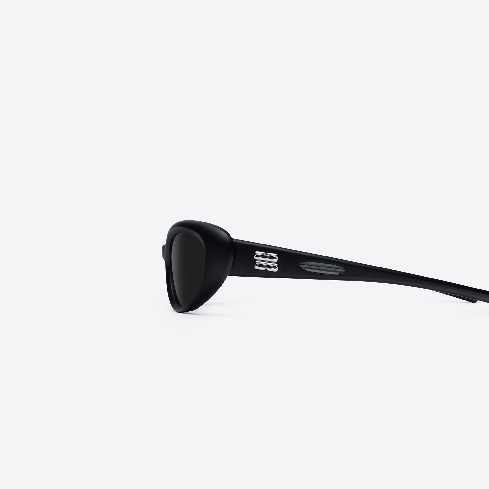 A detailed left view of Gentle Monster Gelati 01 Black Nylon framed Wraparound sunglasses.