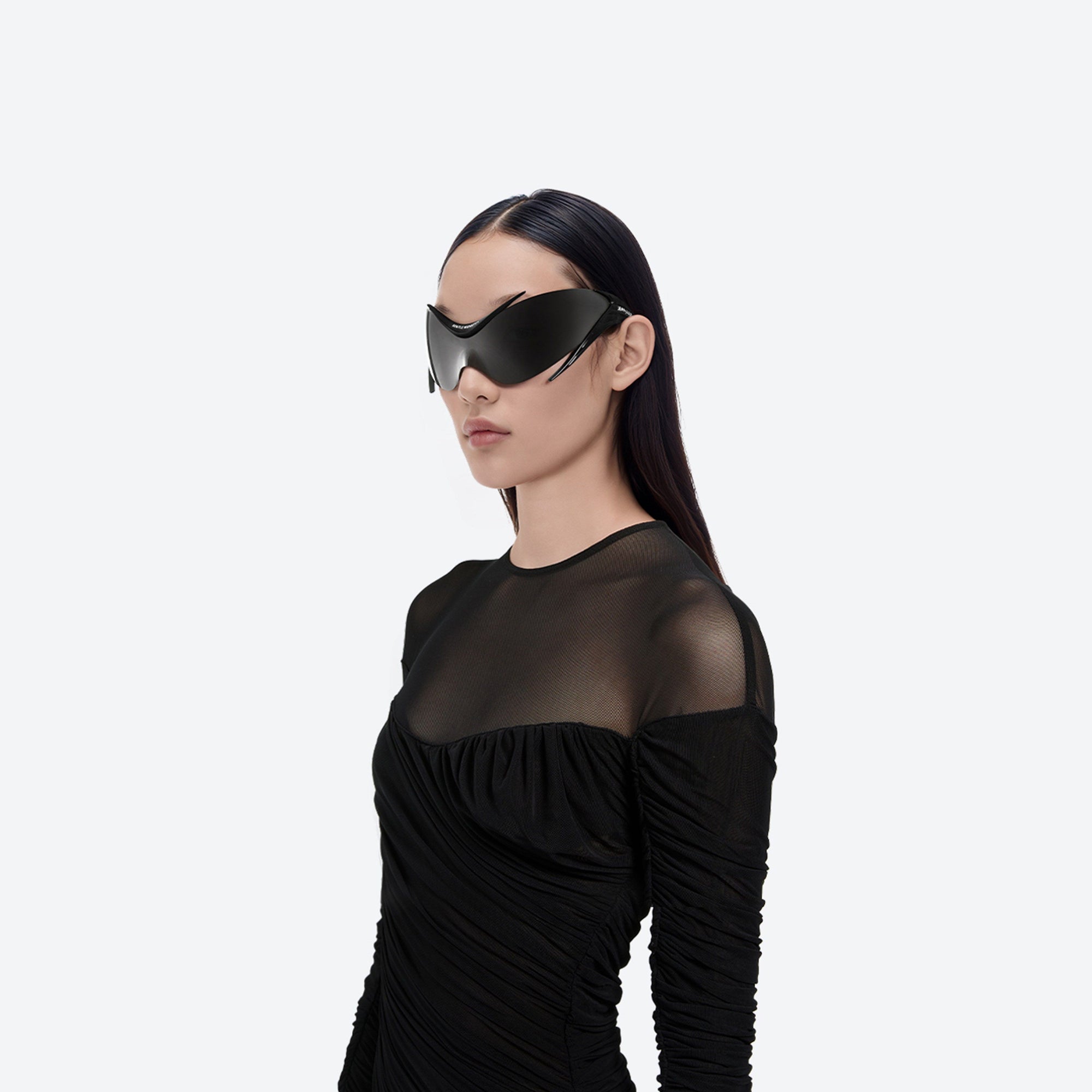 Model wearing the Mugler - Spiral 01 M01 Black Nylon framed Wraparound sunglasses.