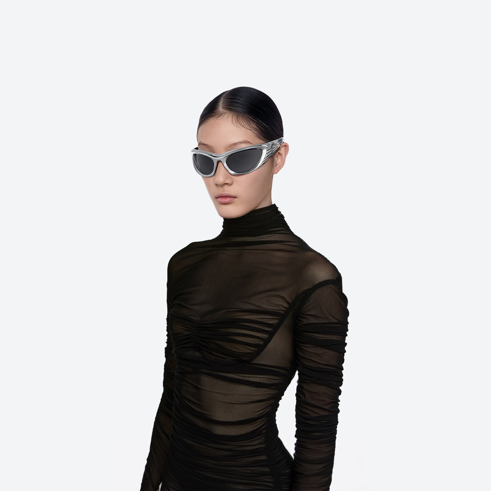 Model wearing the Mugler - Spiral 02 CS1 Silver Nylon framed Wraparound sunglasses.