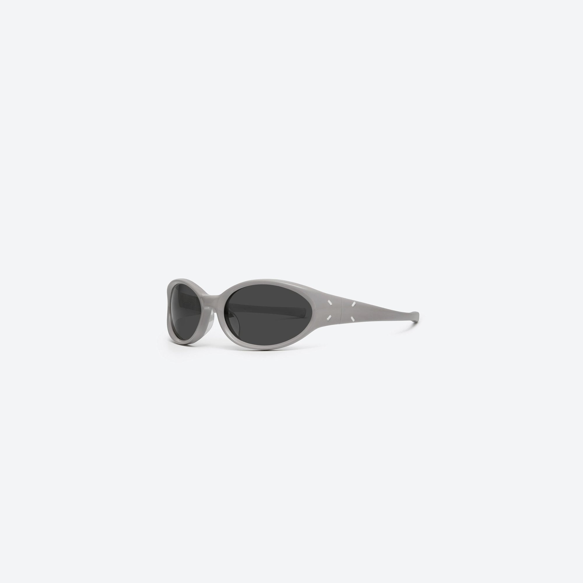 45-degree view of Gentle Monster Maison Margiela - MM104 G10 Gray Acetate framed Wraparound sunglasses.