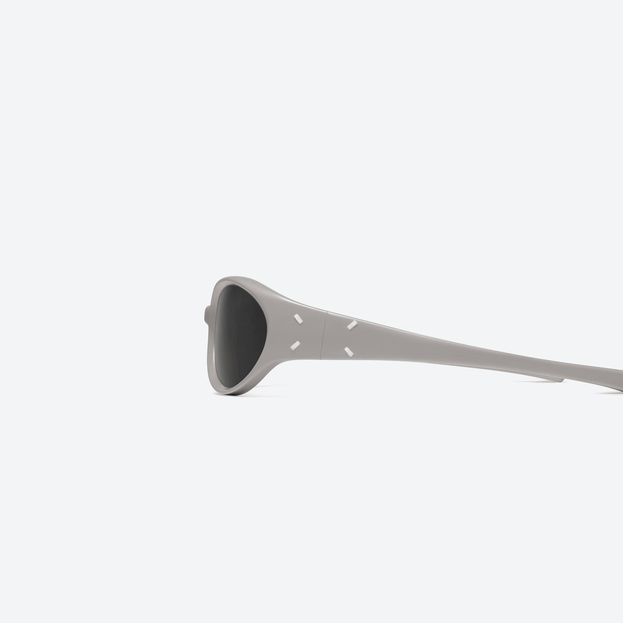 A detailed left view of Gentle Monster Maison Margiela - MM104 G10 Gray Acetate framed Wraparound sunglasses.