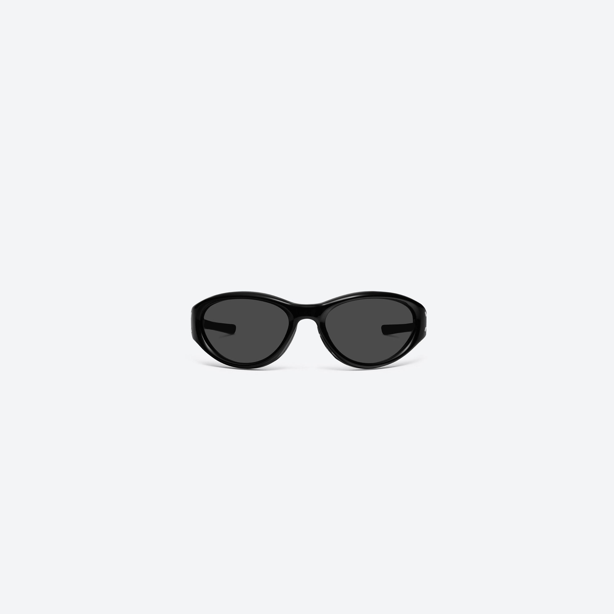 A front view of Gentle Monster Maison Margiela - MM105 01 Black Acetate framed Wraparound sunglasses.