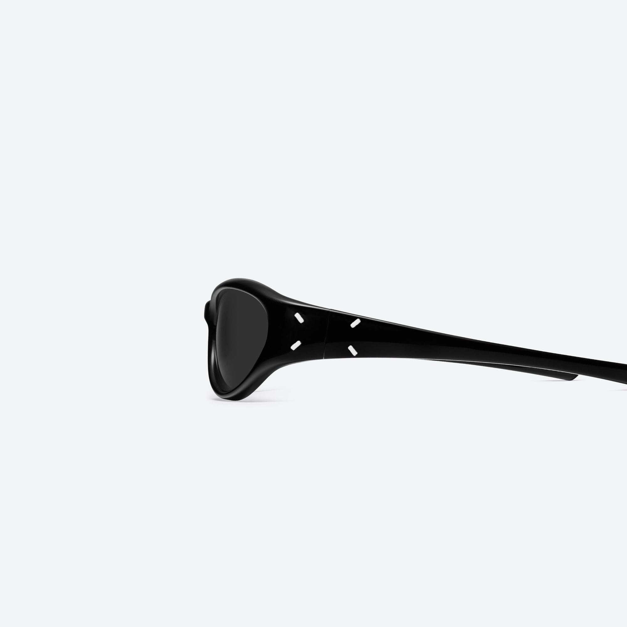 A detailed left view of Gentle Monster Maison Margiela - MM105 01 Black Acetate framed Wraparound sunglasses.