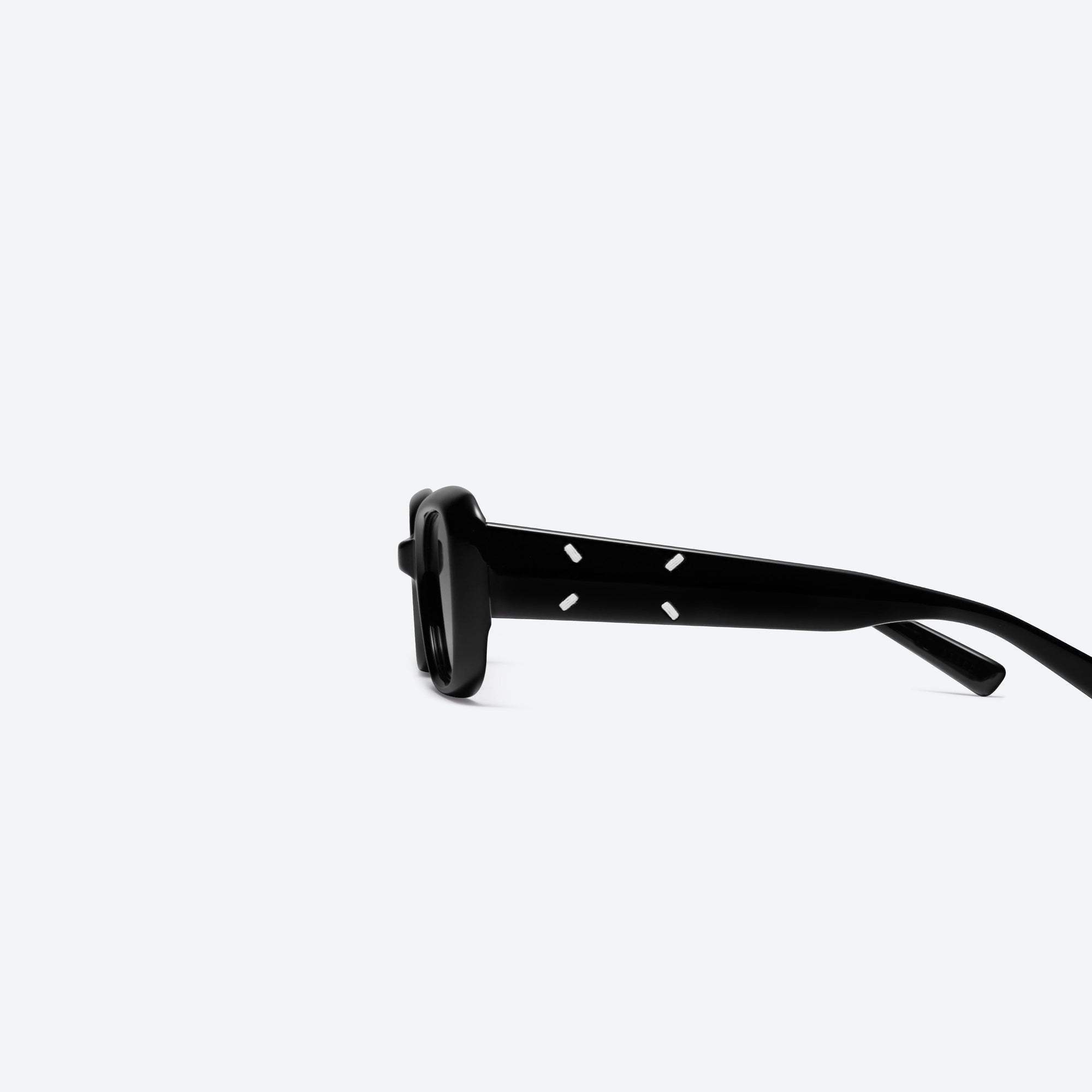 A detailed left view of Gentle Monster Maison Margiela - MM106 01 Black Acetate framed Square sunglasses.