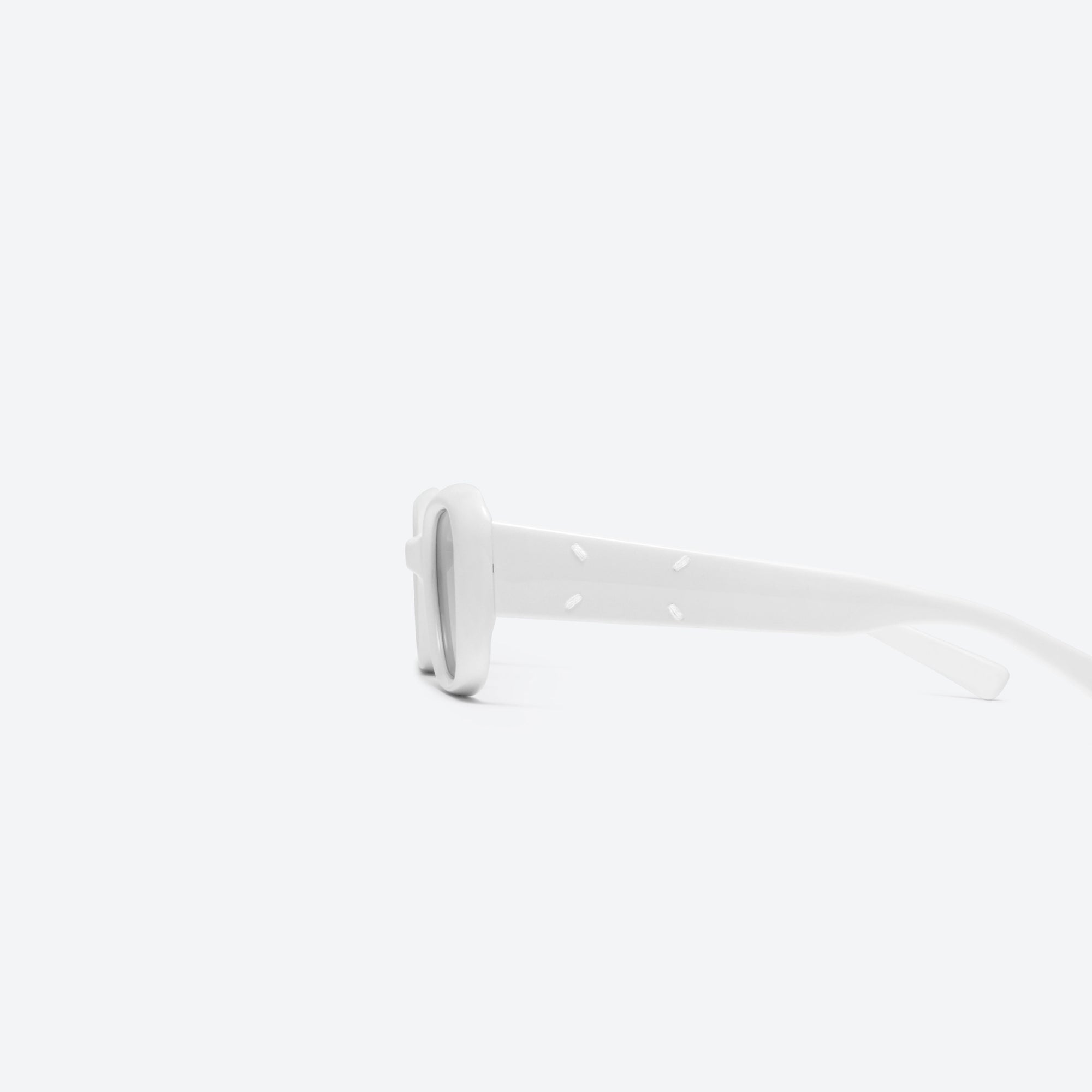 A detailed left view of Gentle Monster Maison Margiela - MM106 W2 White Acetate framed Square sunglasses.