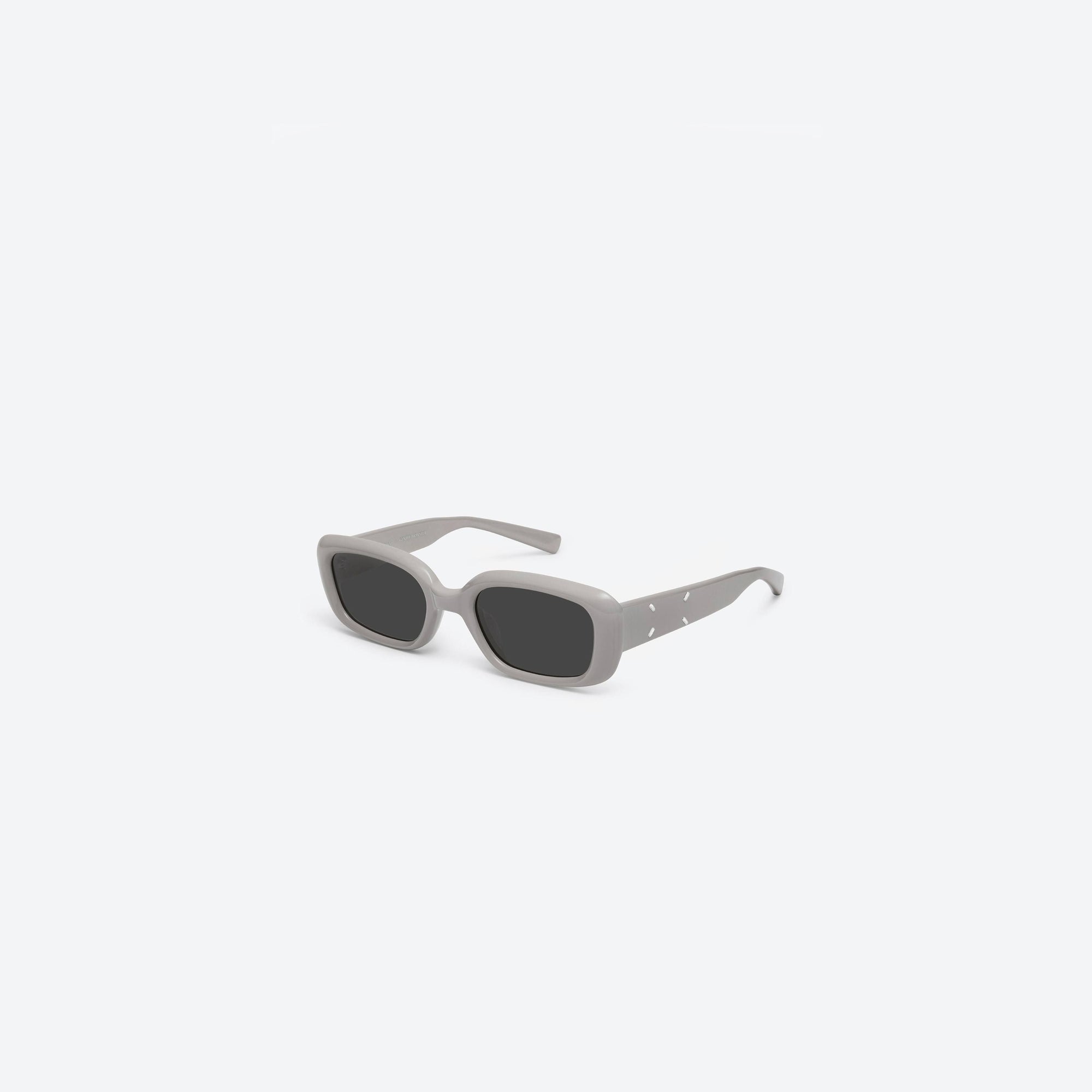 45-degree view of Gentle Monster Maison Margiela - MM106 G10 Gray Acetate framed Square sunglasses.