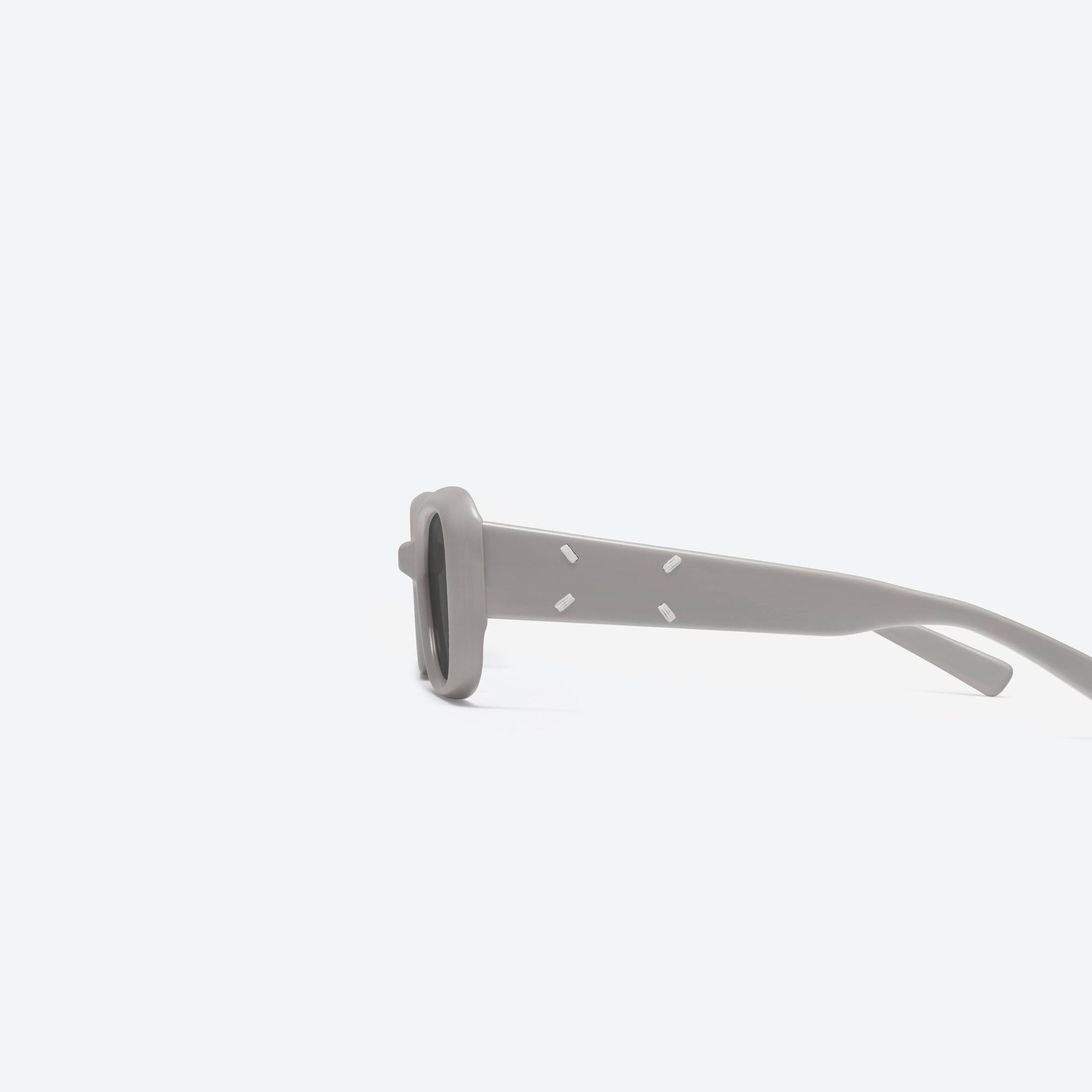 A detailed left view of Gentle Monster Maison Margiela - MM106 G10 Gray Acetate framed Square sunglasses.