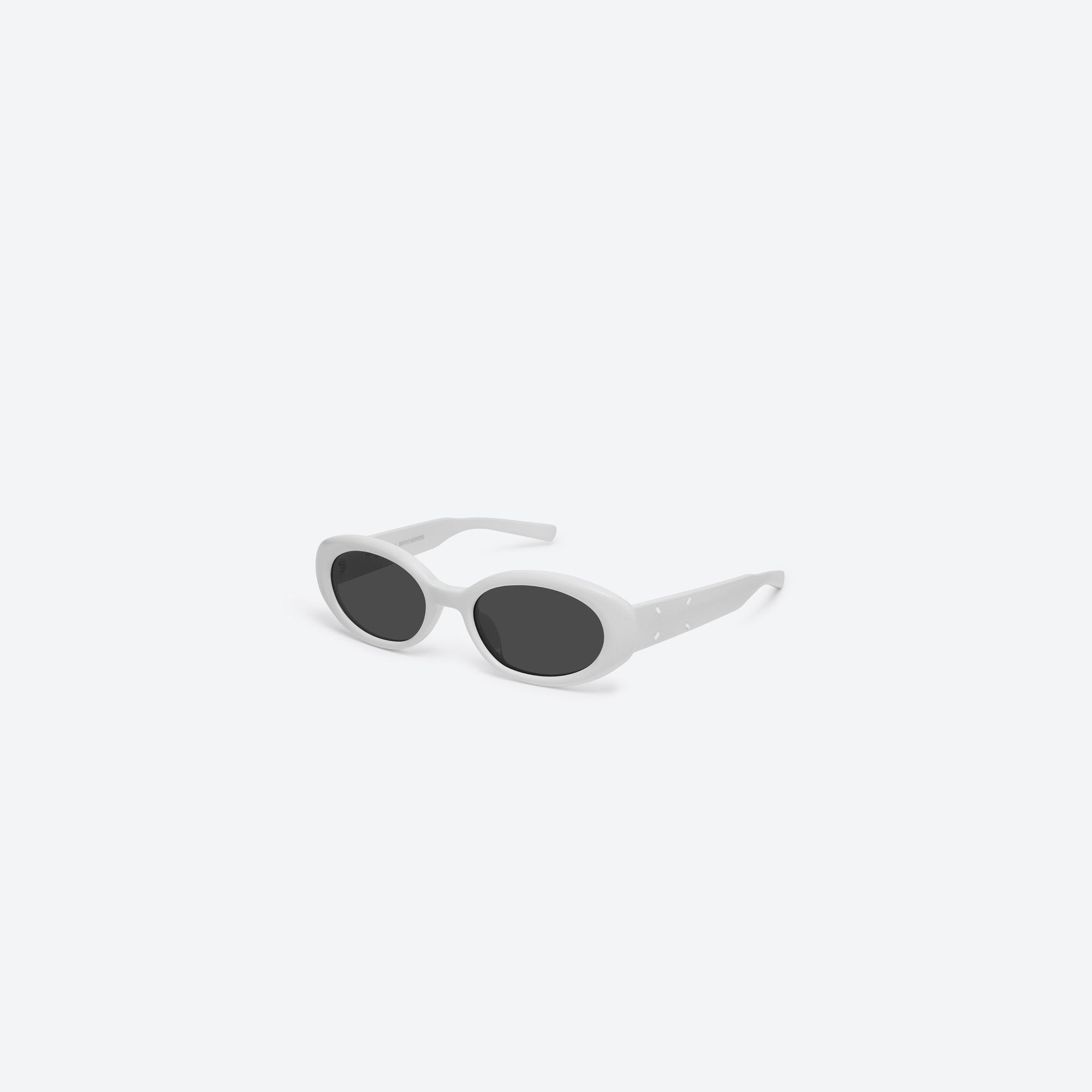 45-degree view of Gentle Monster Maison Margiela - MM107 W2 White Acetate framed Oval sunglasses.