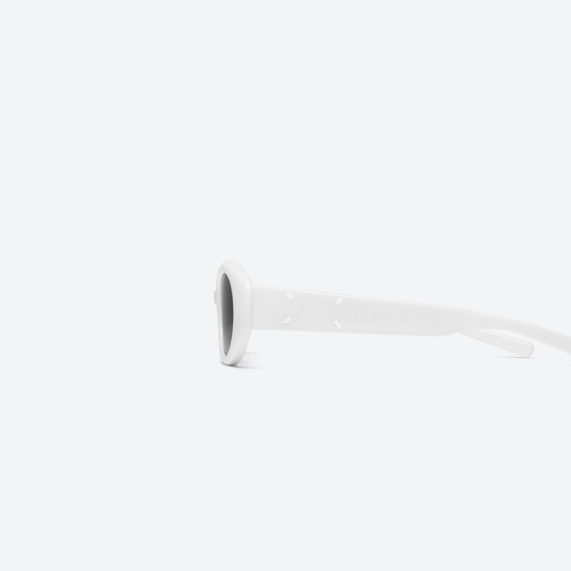A detailed left view of Gentle Monster Maison Margiela - MM107 W2 White Acetate framed Oval sunglasses.