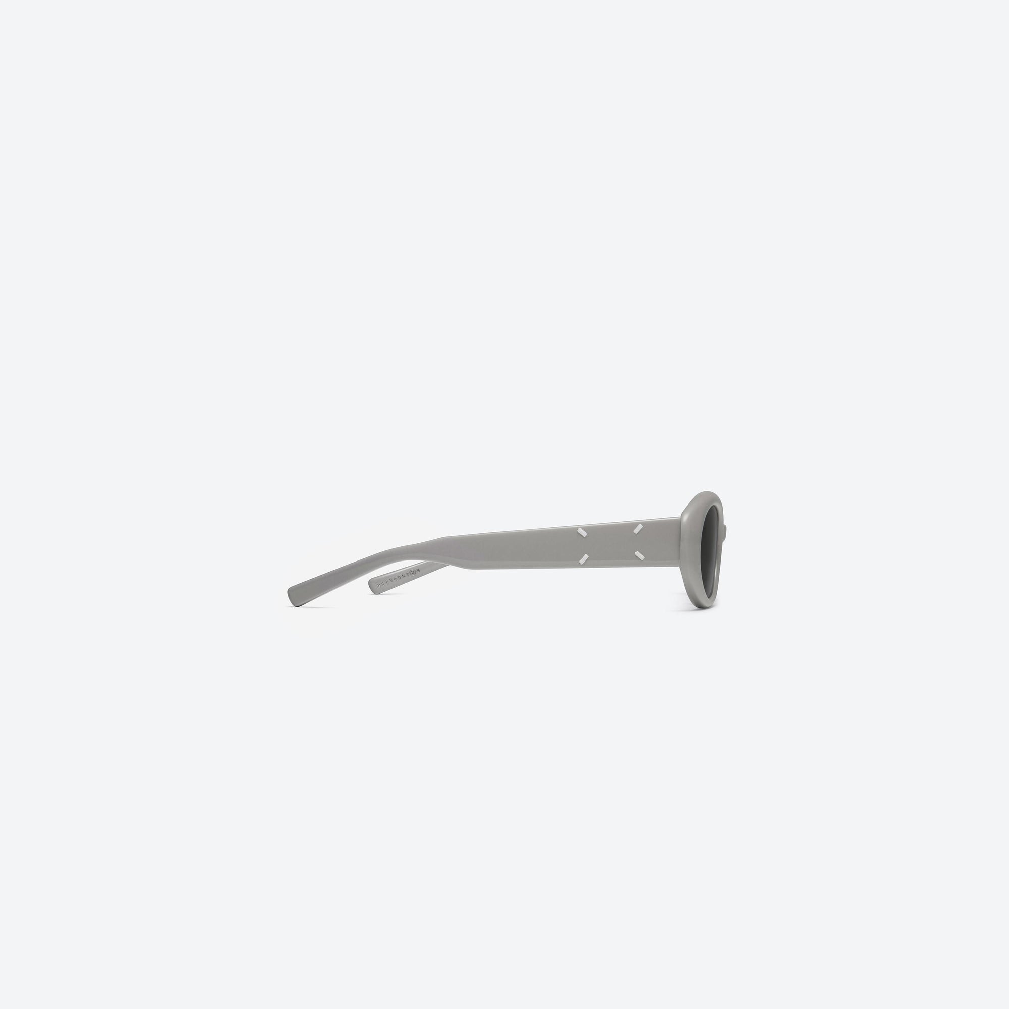 A detailed right view of Gentle Monster Maison Margiela - MM107 G10 Gray Acetate framed Oval sunglasses.