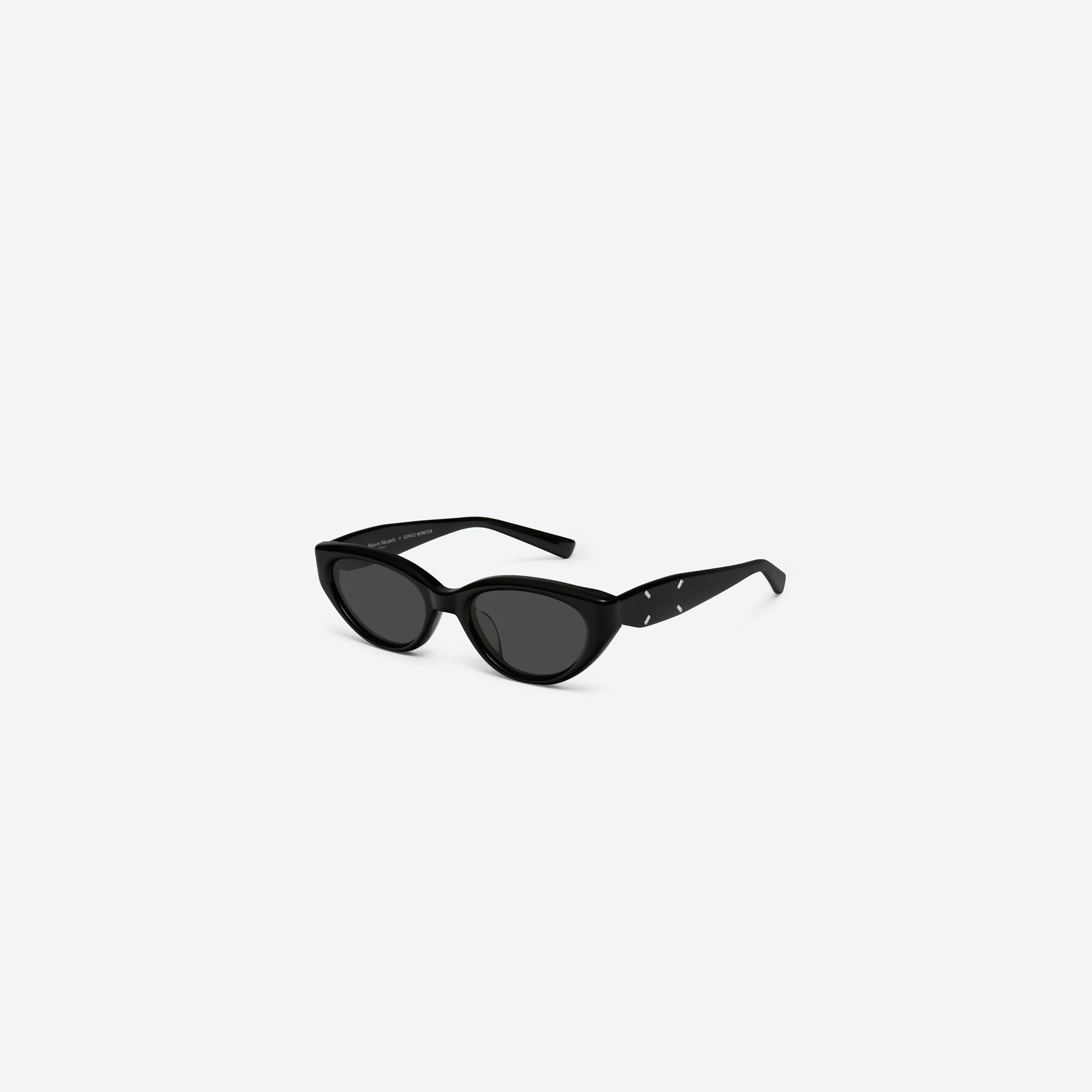 45-degree view of Gentle Monster Maison Margiela - MM108 01 Black Acetate framed Cat-eye sunglasses.