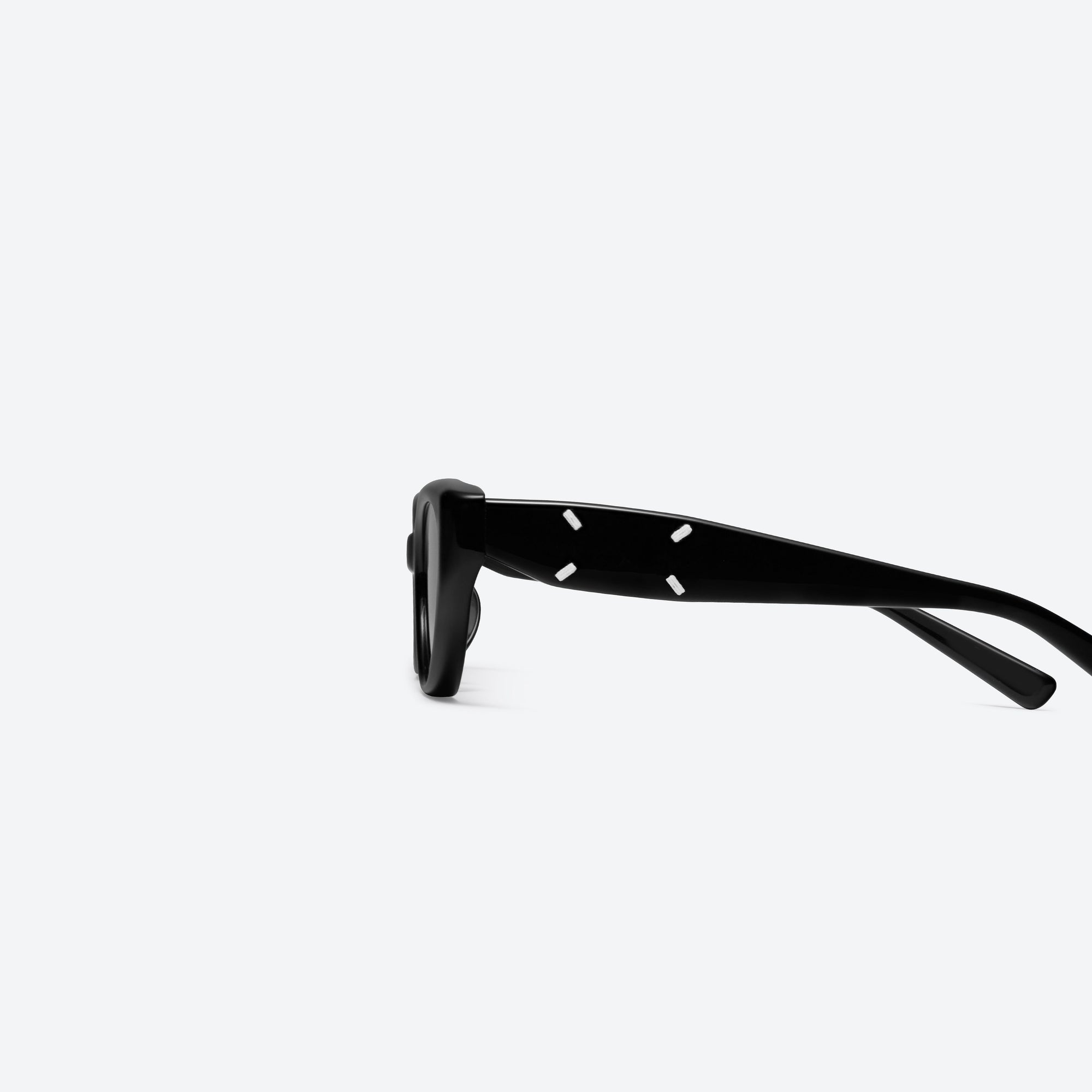 A detailed left view of Gentle Monster Maison Margiela - MM108 01 Black Acetate framed Cat-eye sunglasses.