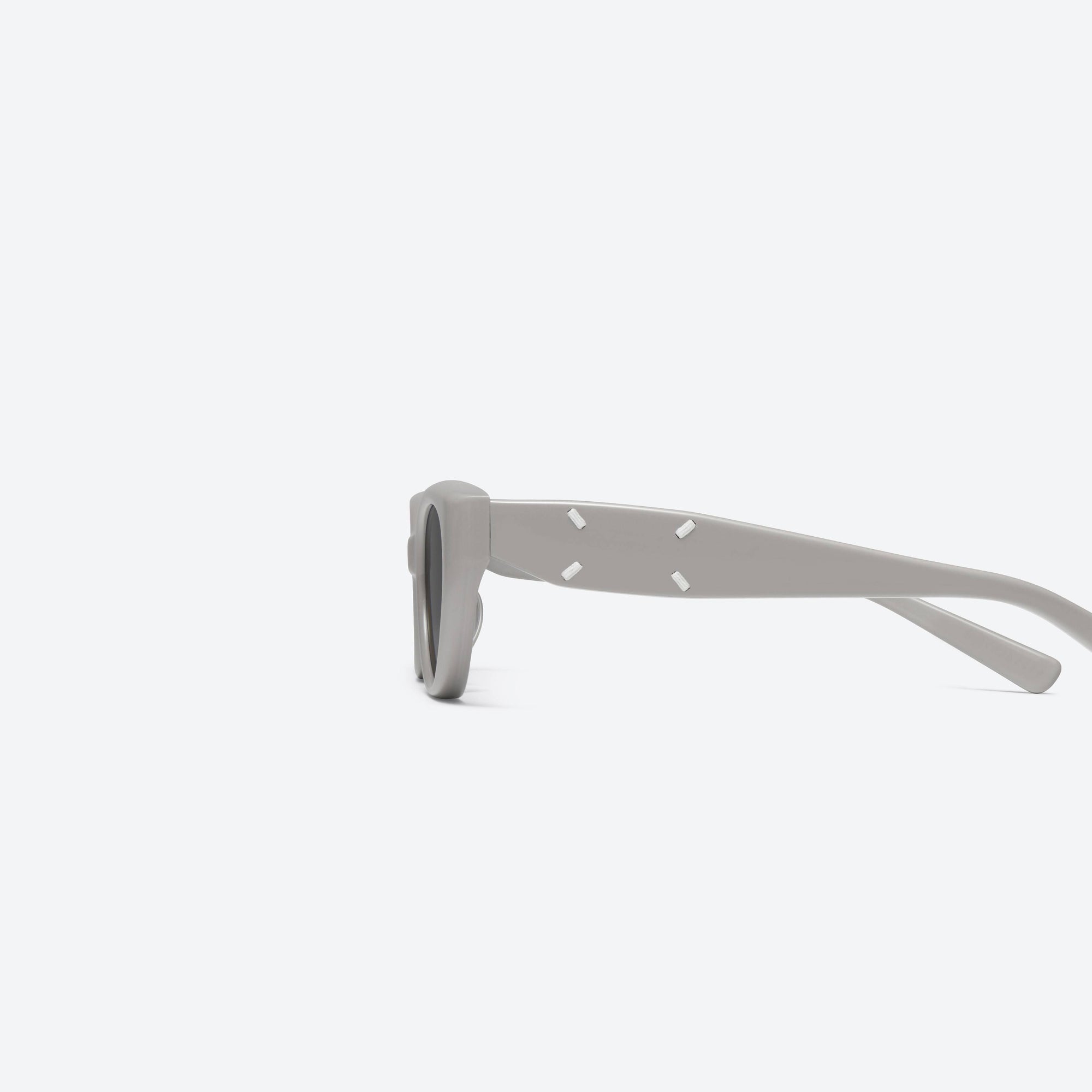 A detailed left view of Gentle Monster Maison Margiela - MM108 G10 Gray Acetate framed Cat-eye sunglasses.