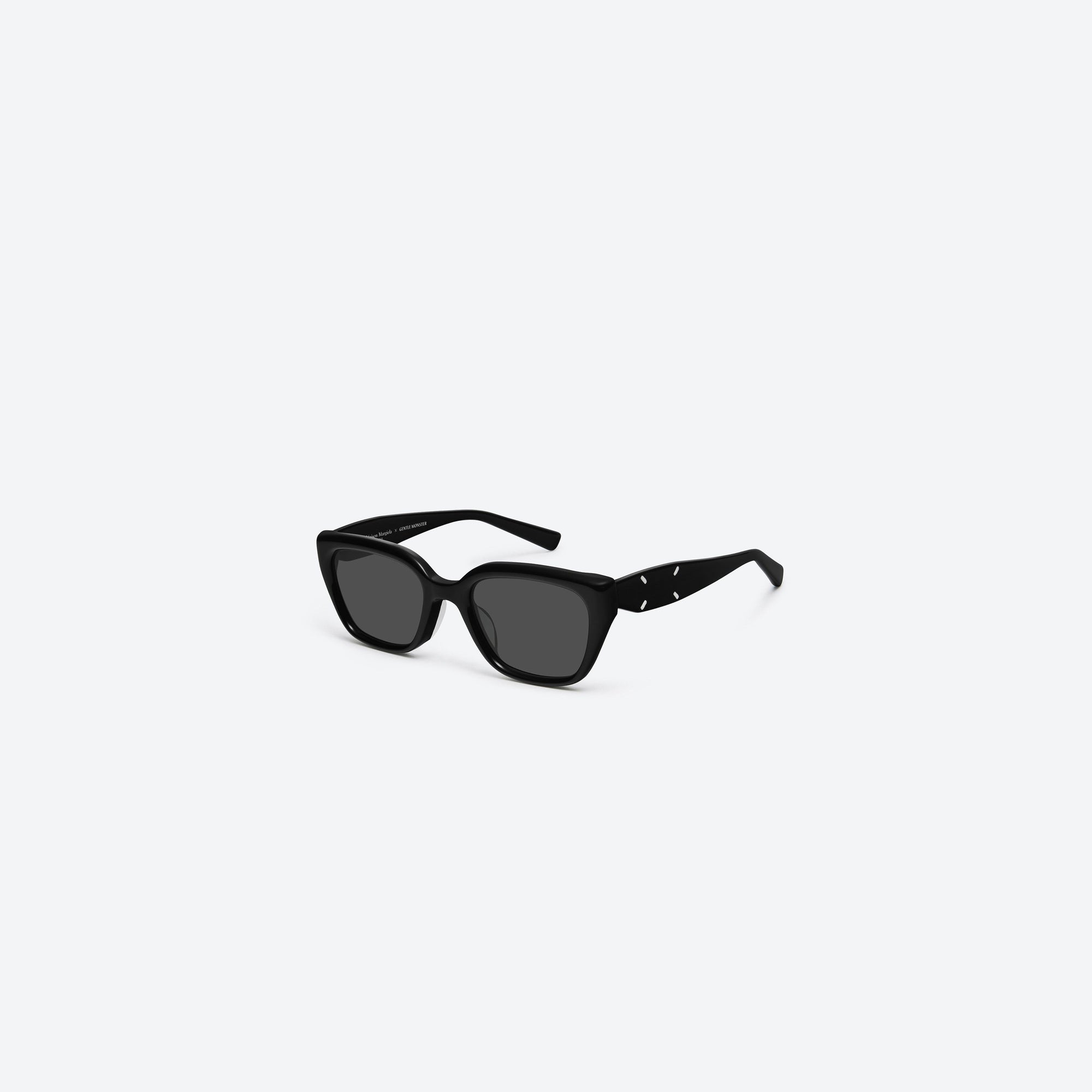 45-degree view of Gentle Monster Maison Margiela - MM109 01 Black Acetate framed Square sunglasses.