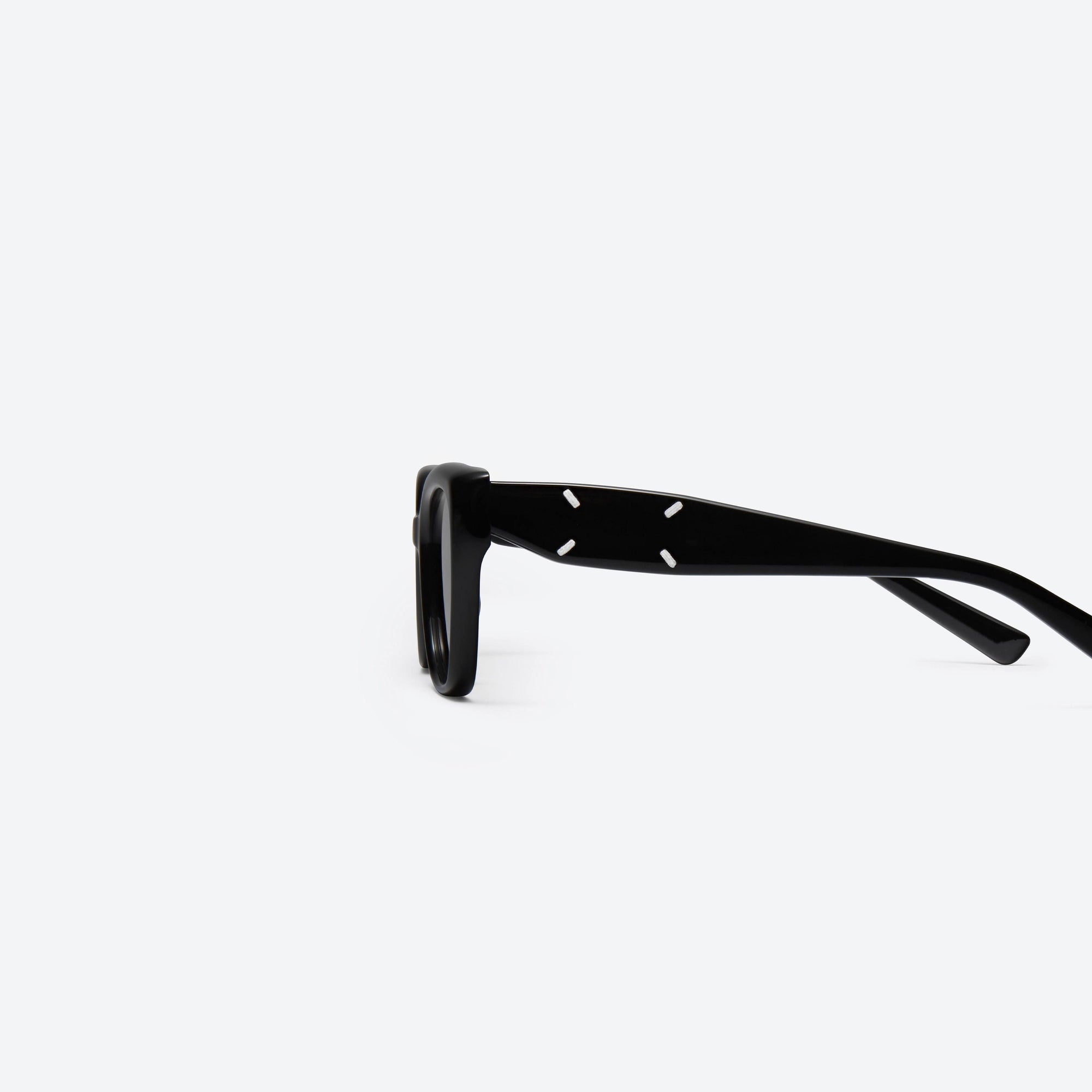A detailed left view of Gentle Monster Maison Margiela - MM109 01 Black Acetate framed Square sunglasses.