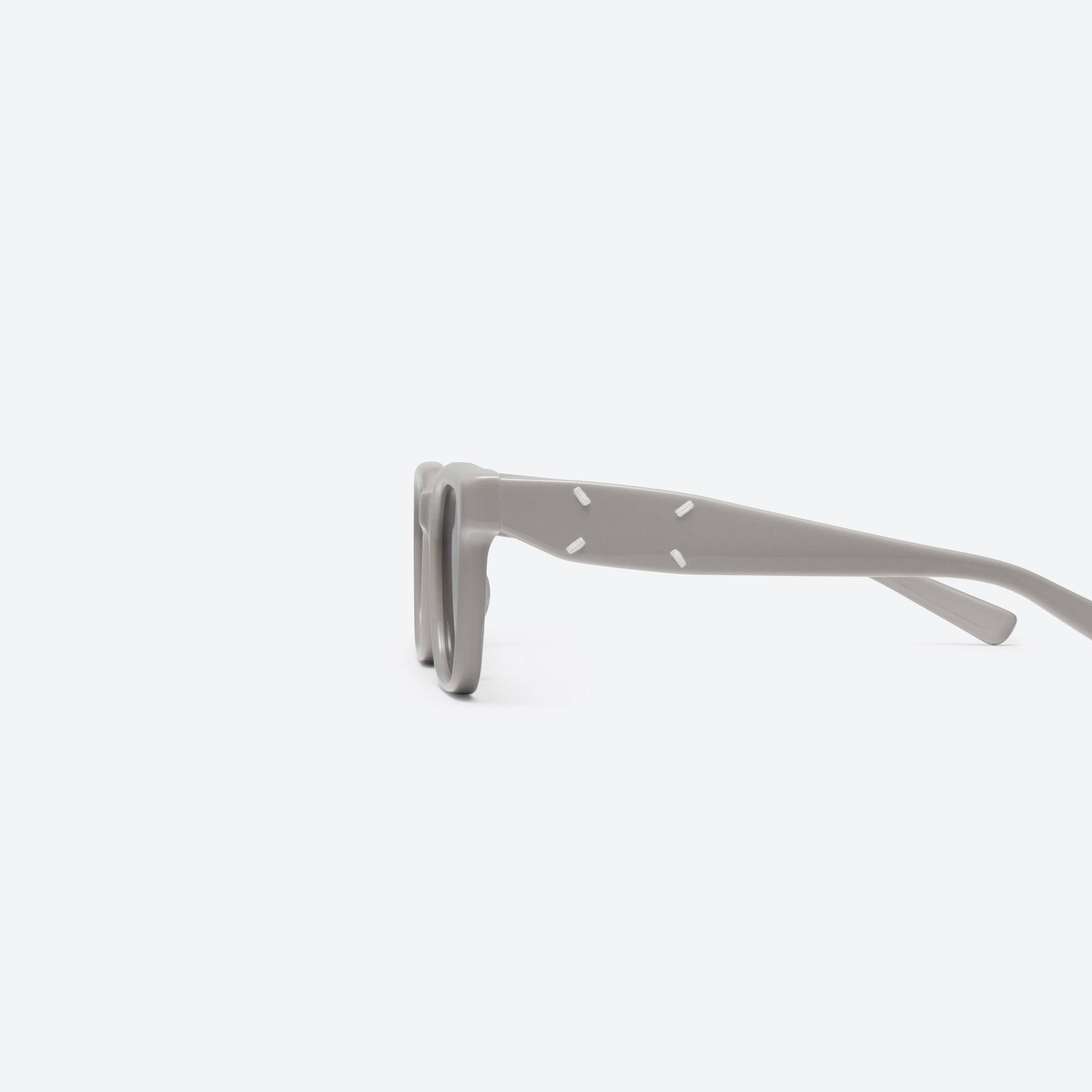 A detailed left view of Gentle Monster Maison Margiela - MM110 G10 Gray Acetate framed Square sunglasses.