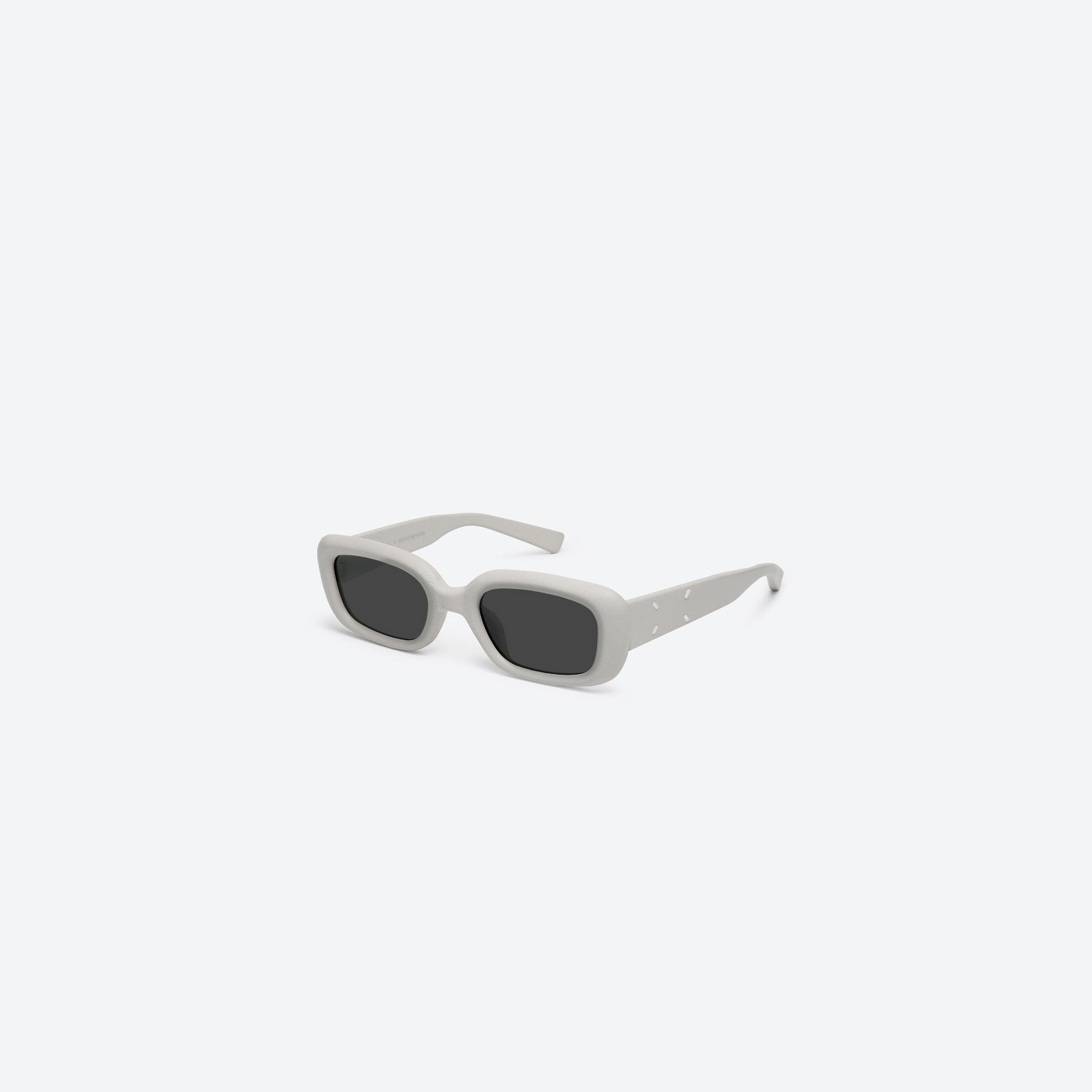 45-degree view of Gentle Monster Maison Margiela - MM106 Leather LIV1 Ivory Acetate framed Square sunglasses.