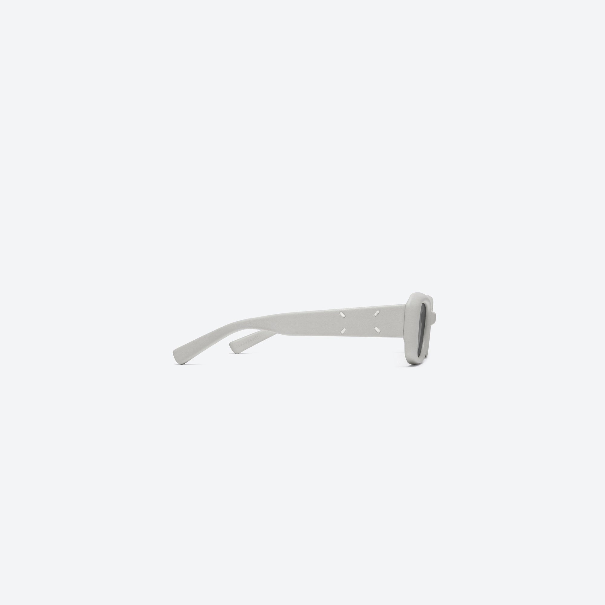 A detailed right view of Gentle Monster Maison Margiela - MM106 Leather LIV1 Ivory Acetate framed Square sunglasses.