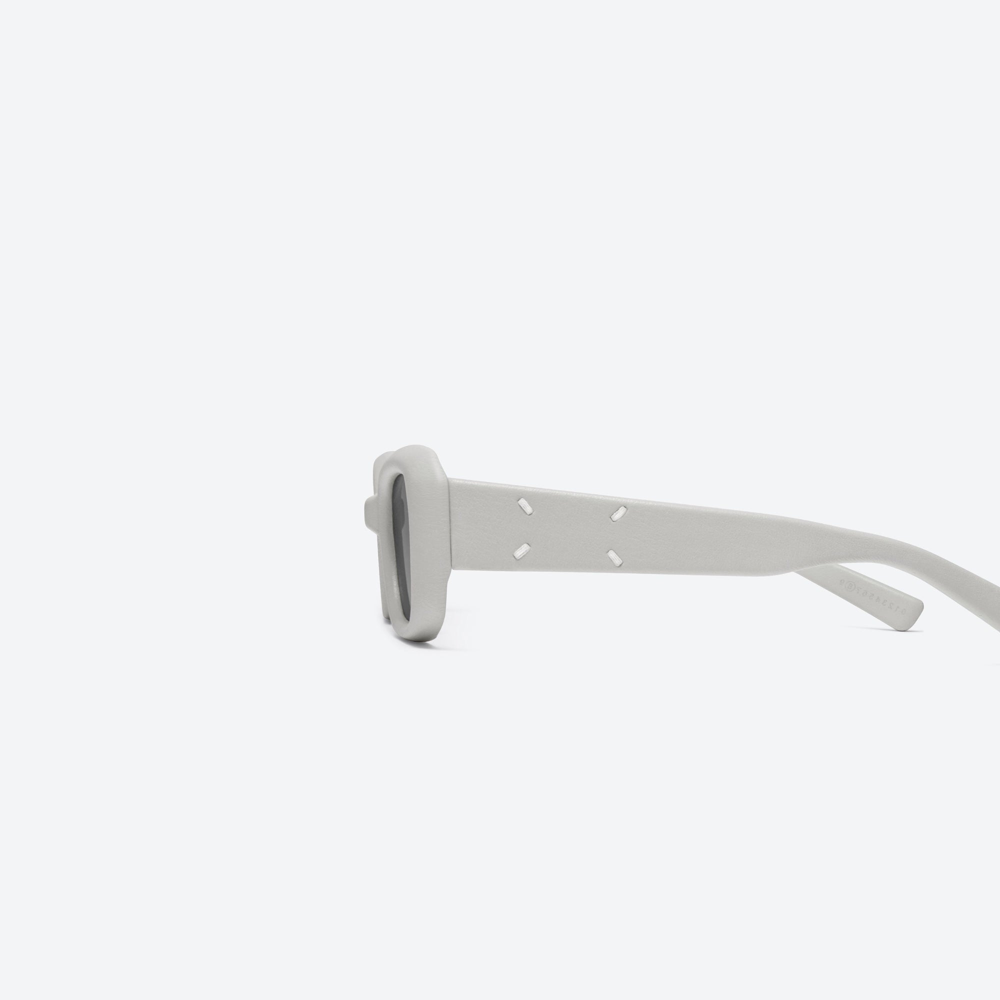 A detailed left view of Gentle Monster Maison Margiela - MM106 Leather LIV1 Ivory Acetate framed Square sunglasses.