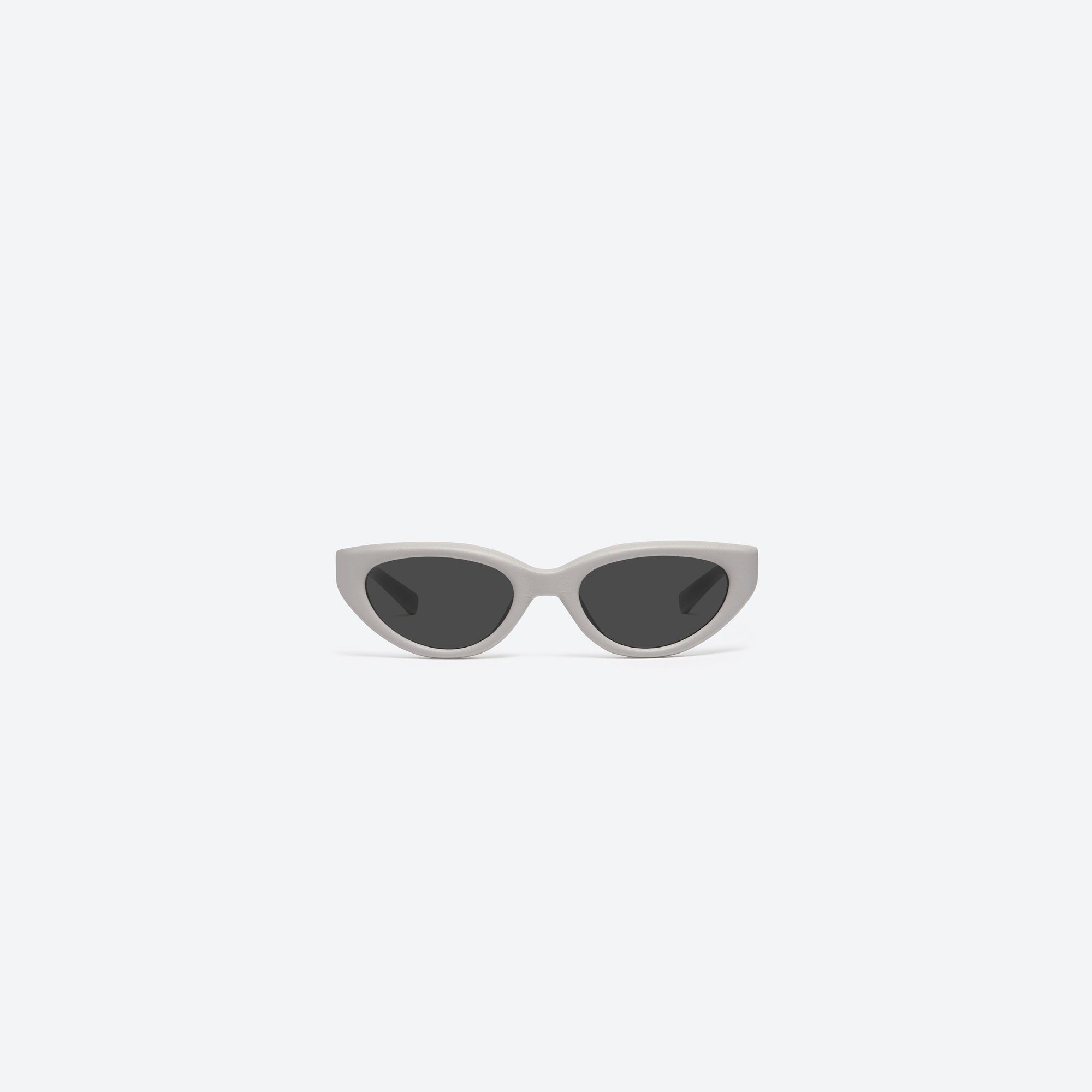 A front view of Gentle Monster Maison Margiela - MM108 Leather LIV1 Ivory Acetate framed Cat-eye sunglasses.