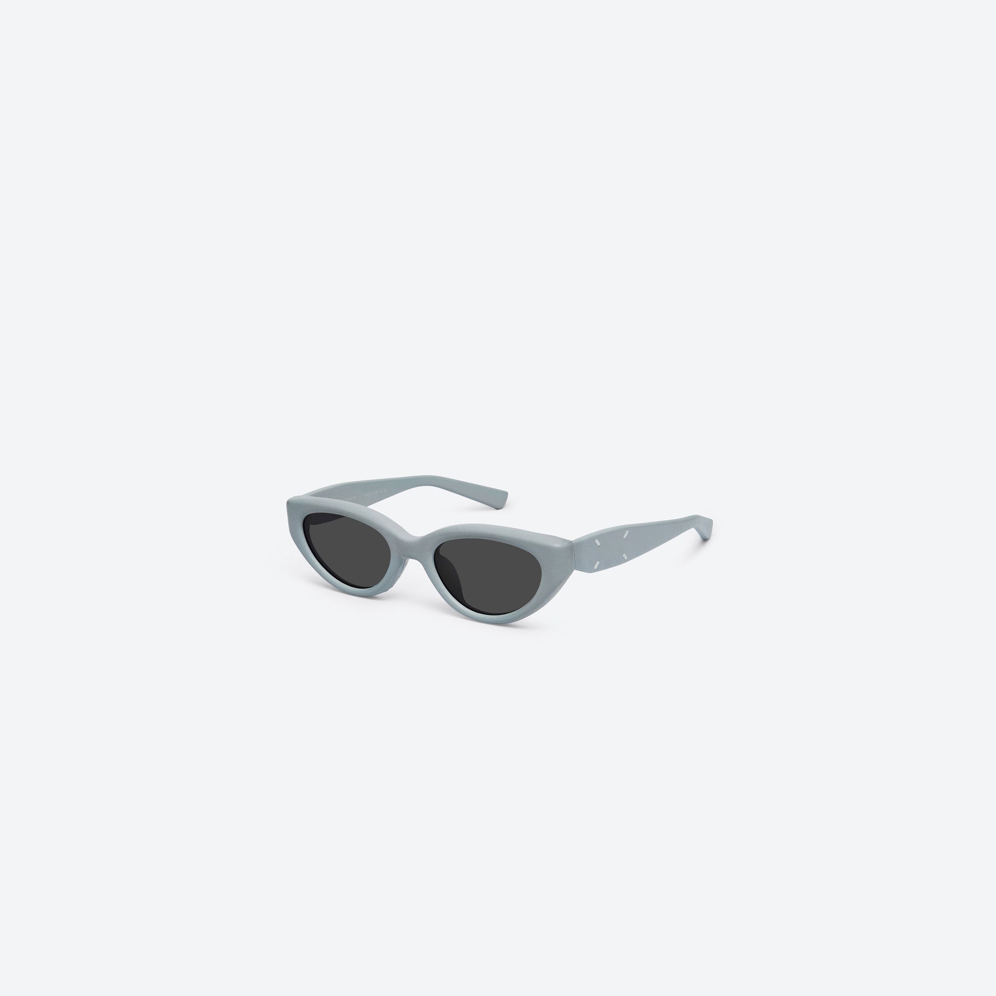 45-degree view of Gentle Monster Maison Margiela - MM108 Leather LBL1 Blue Acetate framed Cat-eye sunglasses.