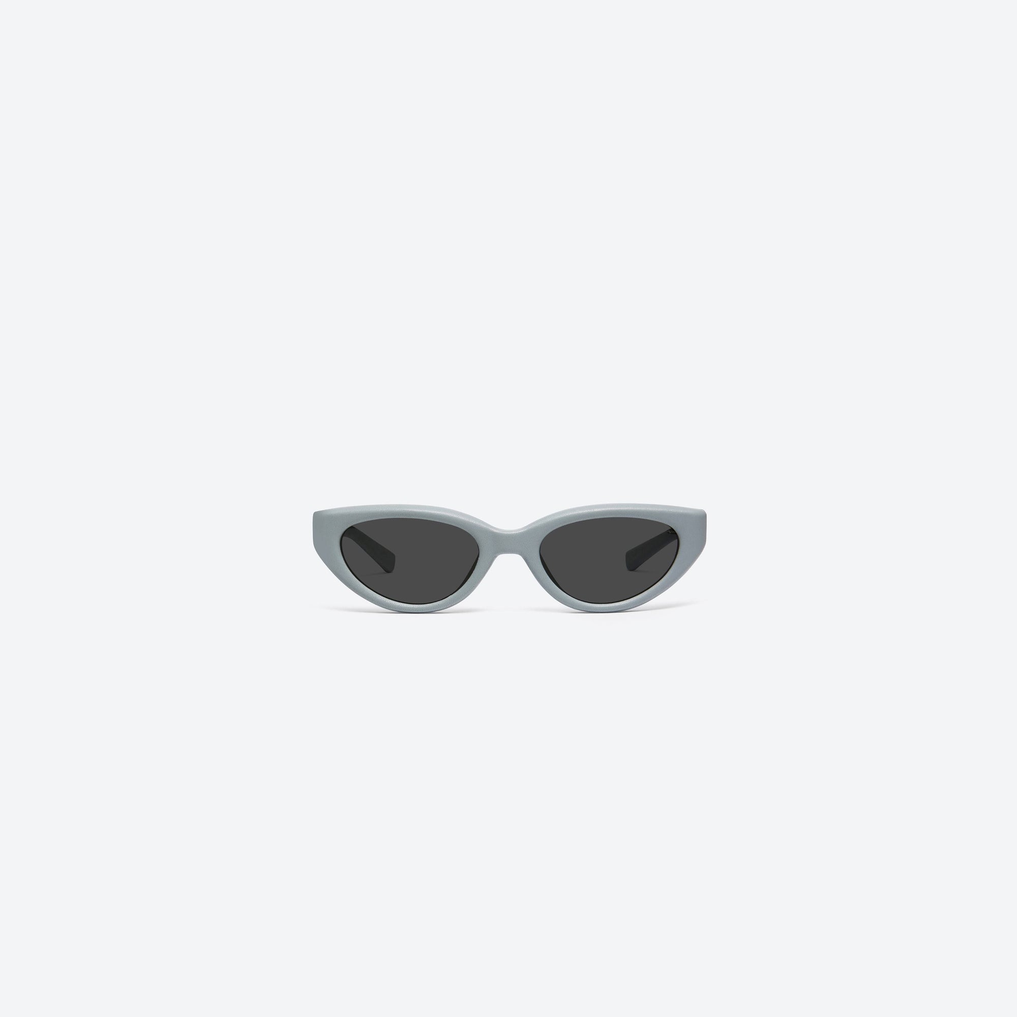 A front view of Gentle Monster Maison Margiela - MM108 Leather LBL1 Blue Acetate framed Cat-eye sunglasses.