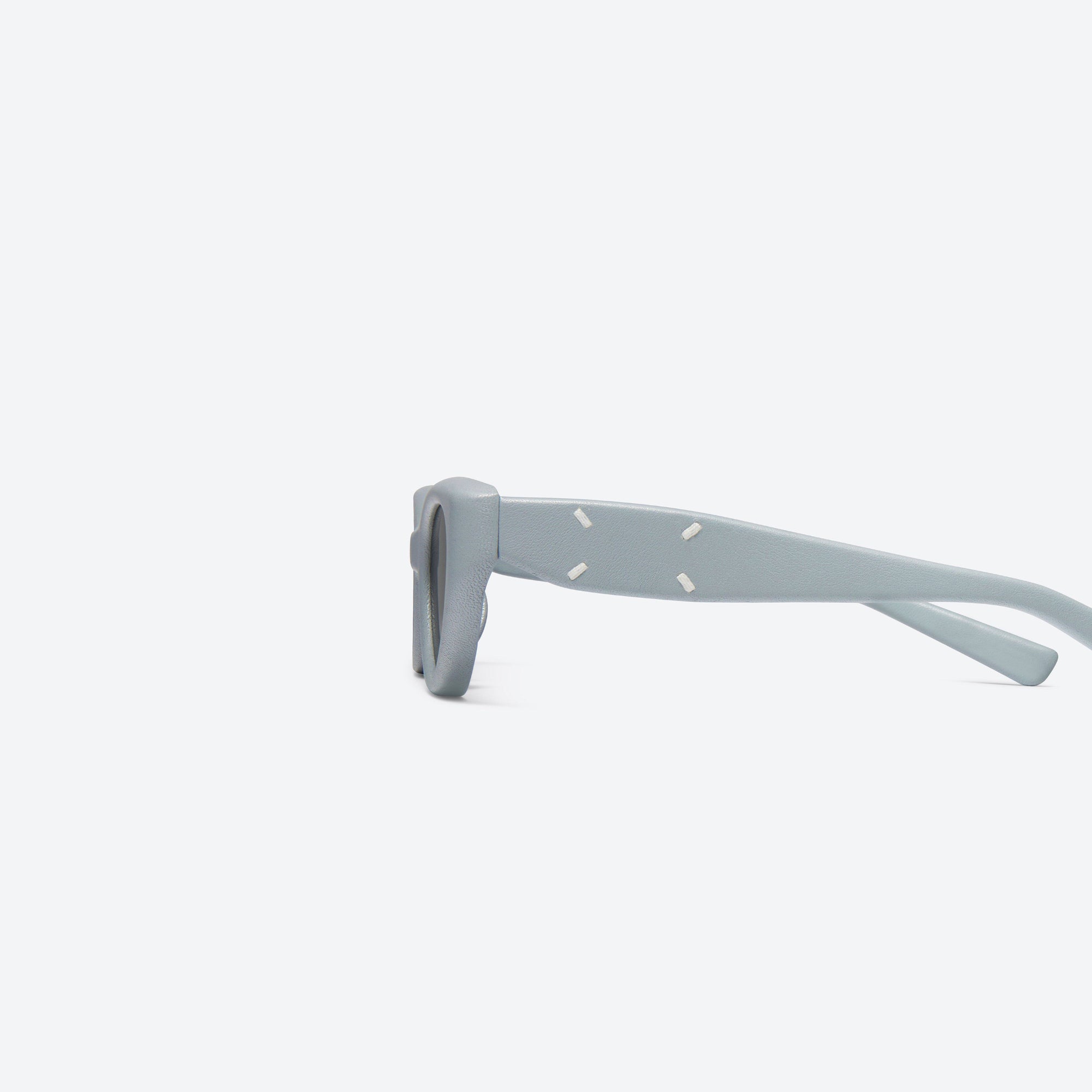 A detailed left view of Gentle Monster Maison Margiela - MM108 Leather LBL1 Blue Acetate framed Cat-eye sunglasses.