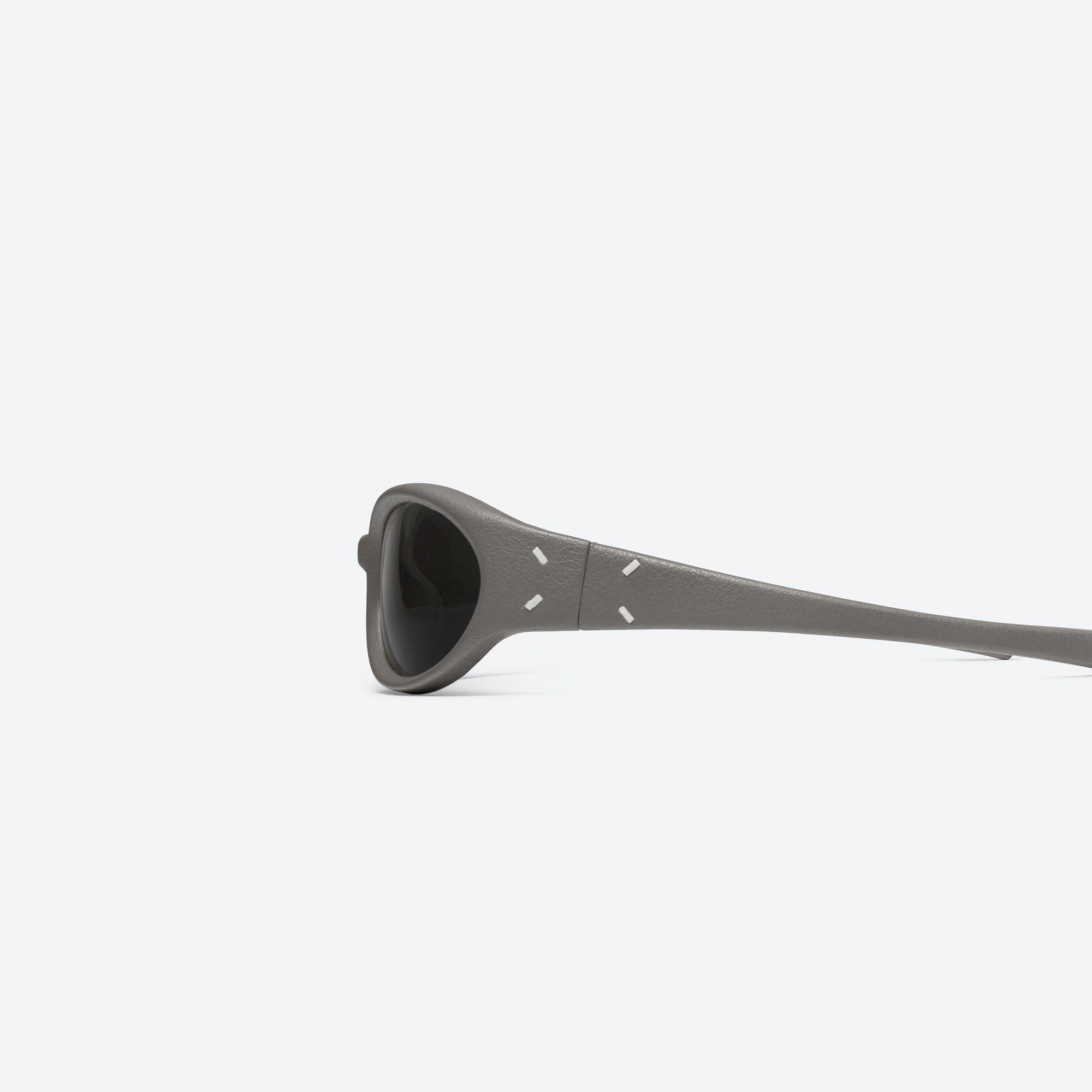 A detailed left view of Gentle Monster Maison Margiela - MM104 Leather LK1 Green Acetate framed Wraparound sunglasses.