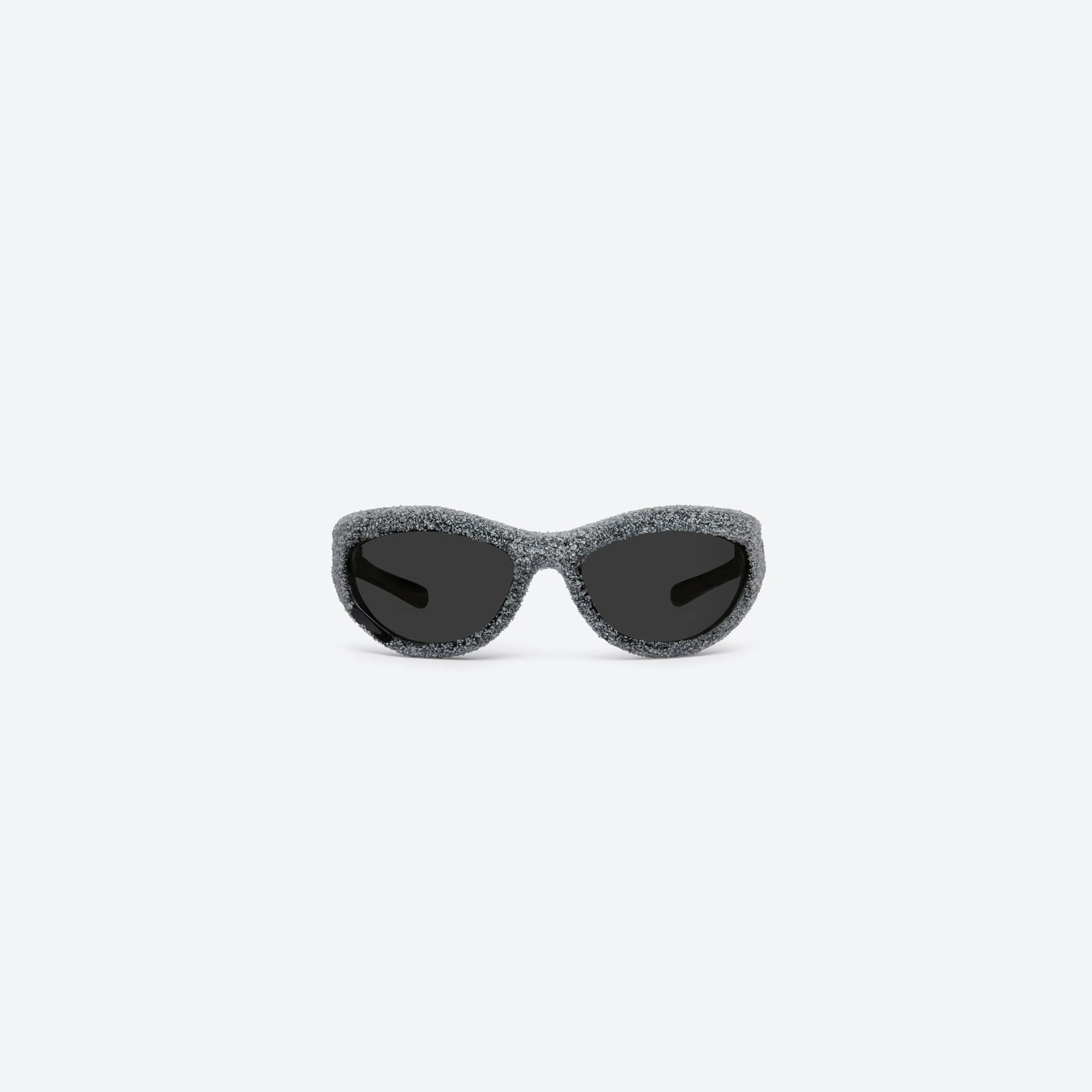 A front view of Gentle Monster Yummy 01 Black Nylon framed Wraparound sunglasses.