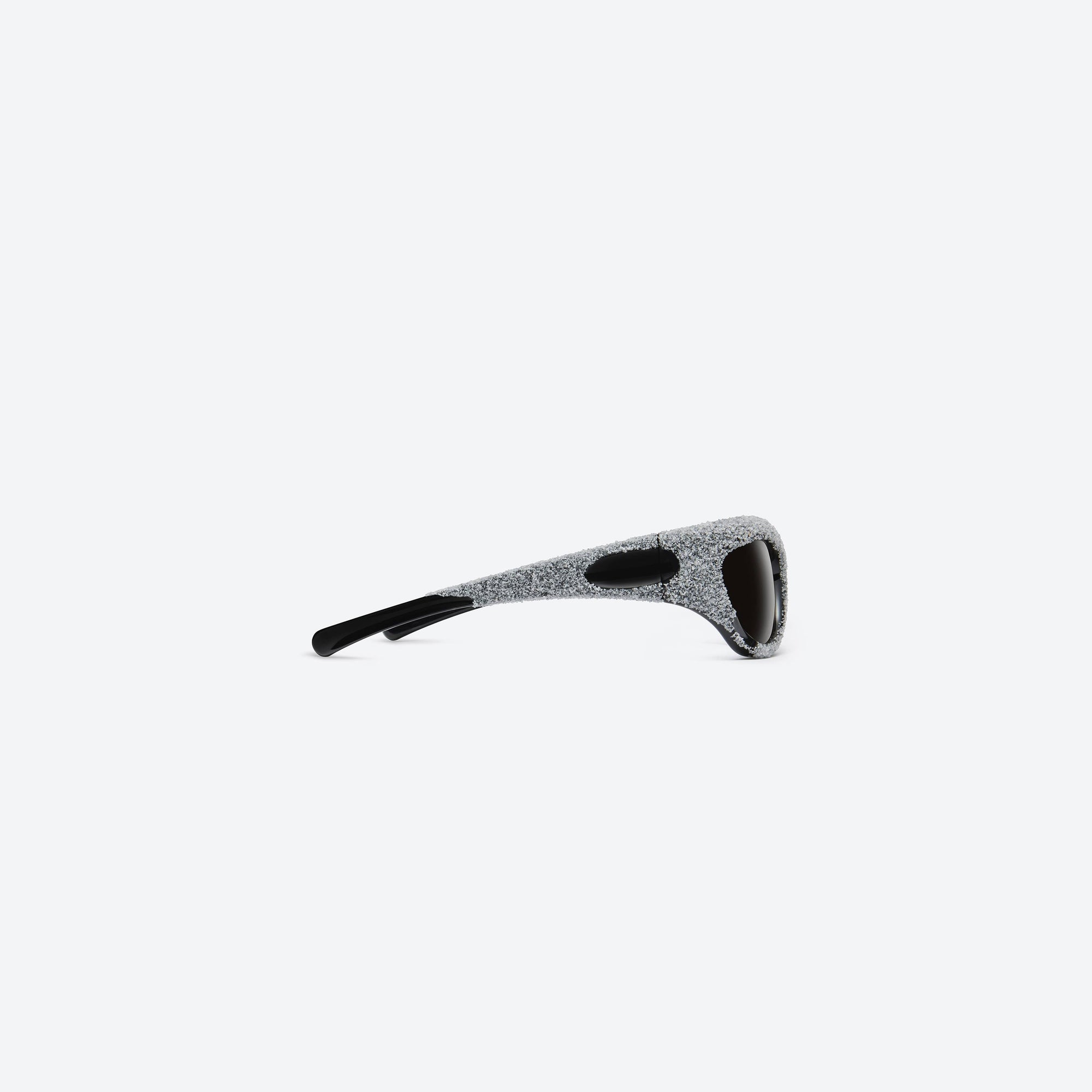 A detailed right view of Gentle Monster Yummy 01 Black Nylon framed Wraparound sunglasses.