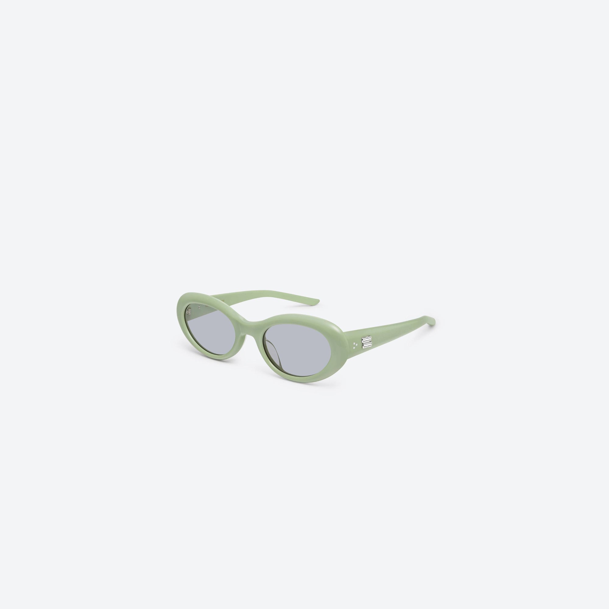 45-degree view of Gentle Monster Avon GR8 Green Acetate framed Oval sunglasses.