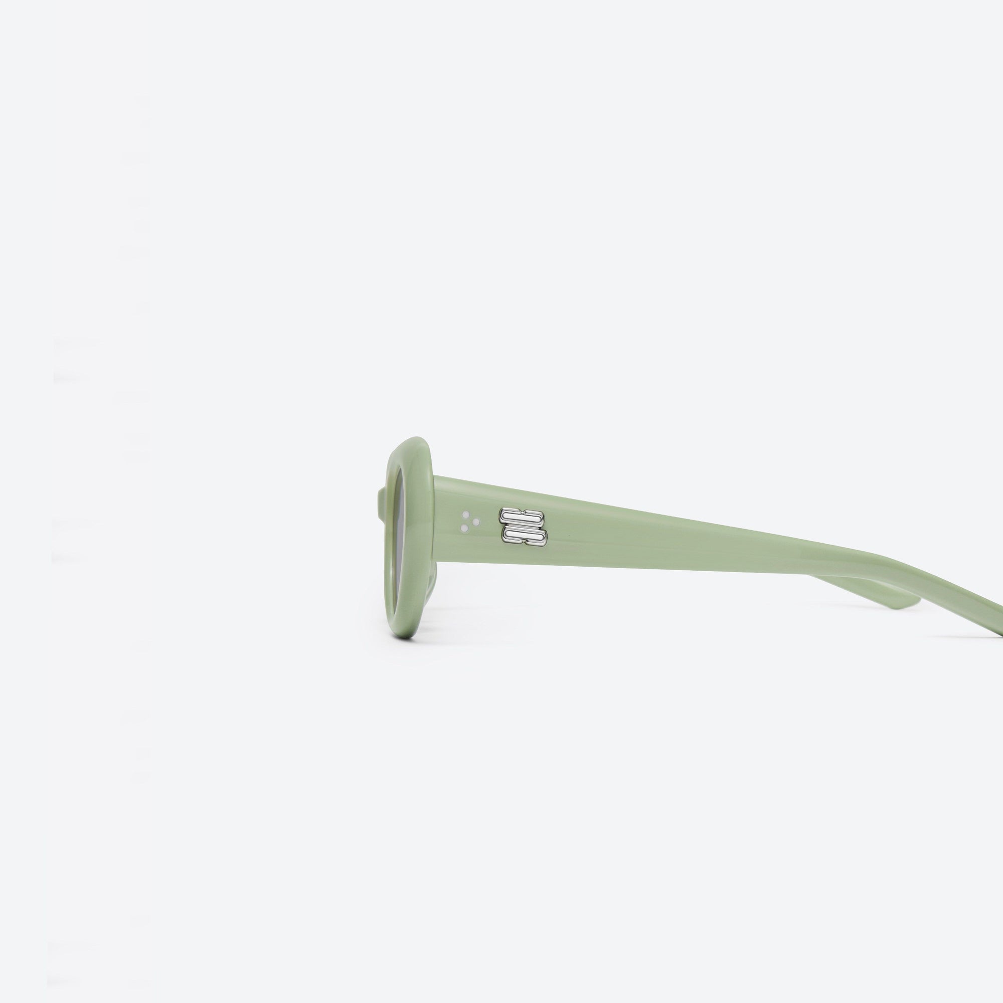 A detailed left view of Gentle Monster Avon GR8 Green Acetate framed Oval sunglasses.