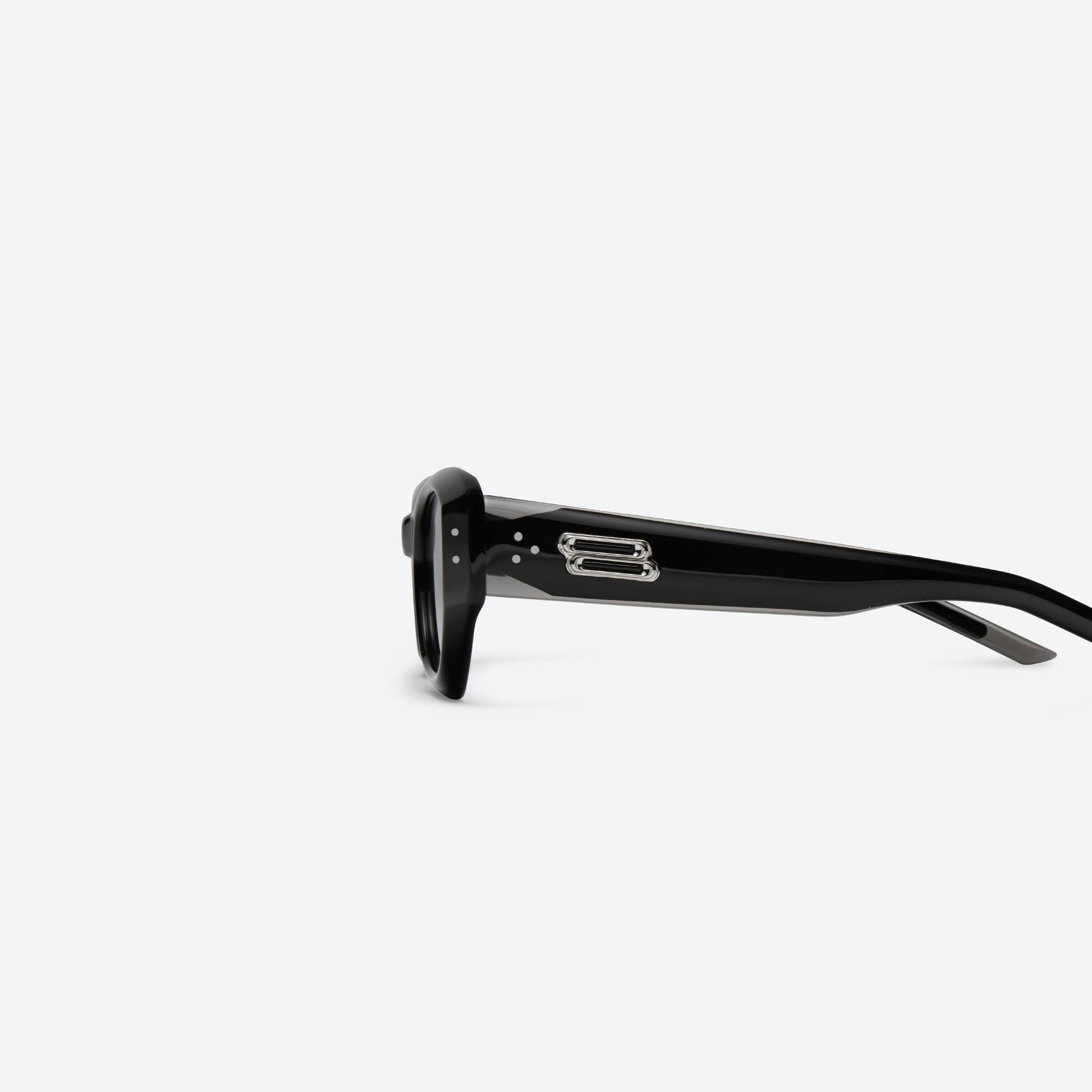 A detailed left view of Gentle Monster Benven 01 Black Acetate framed Cat-eye sunglasses.
