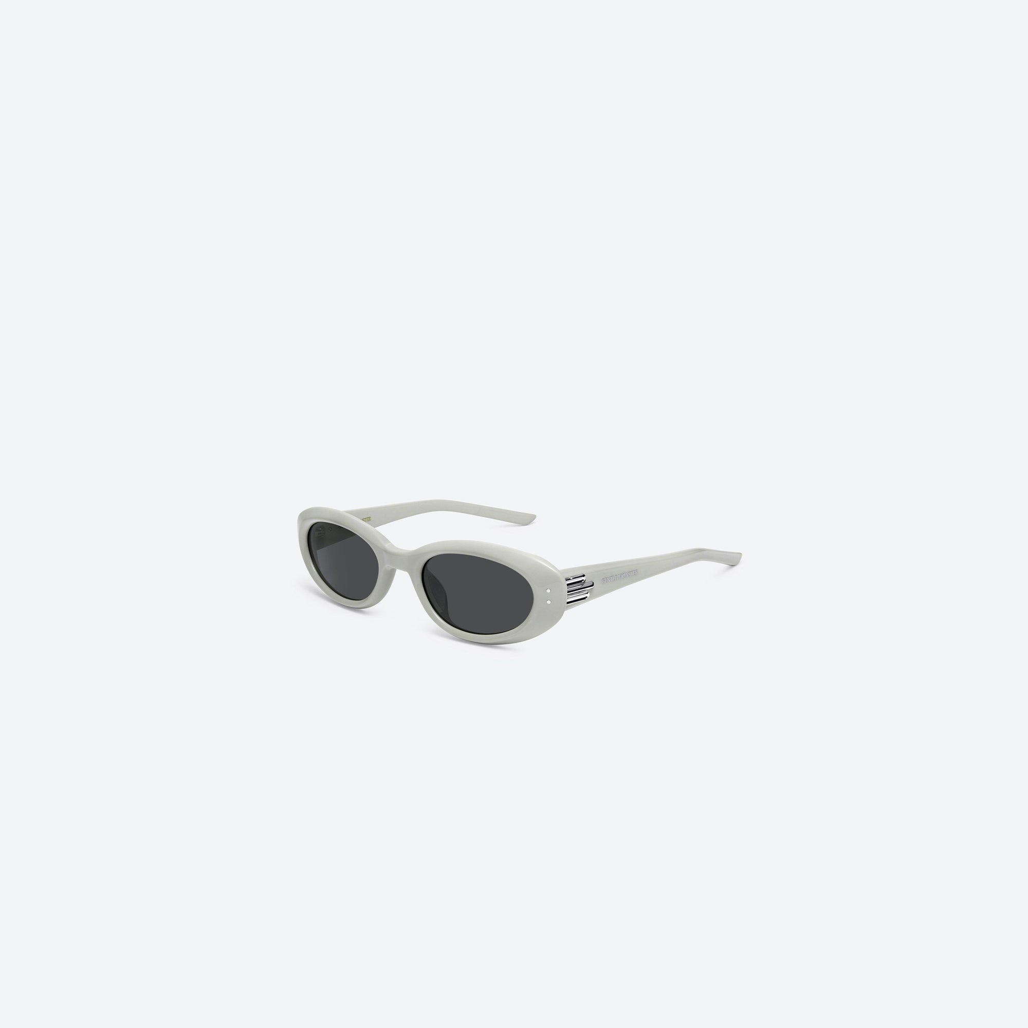 45-degree view of Gentle Monster Blanc G12 Gray Acetate framed Oval sunglasses.