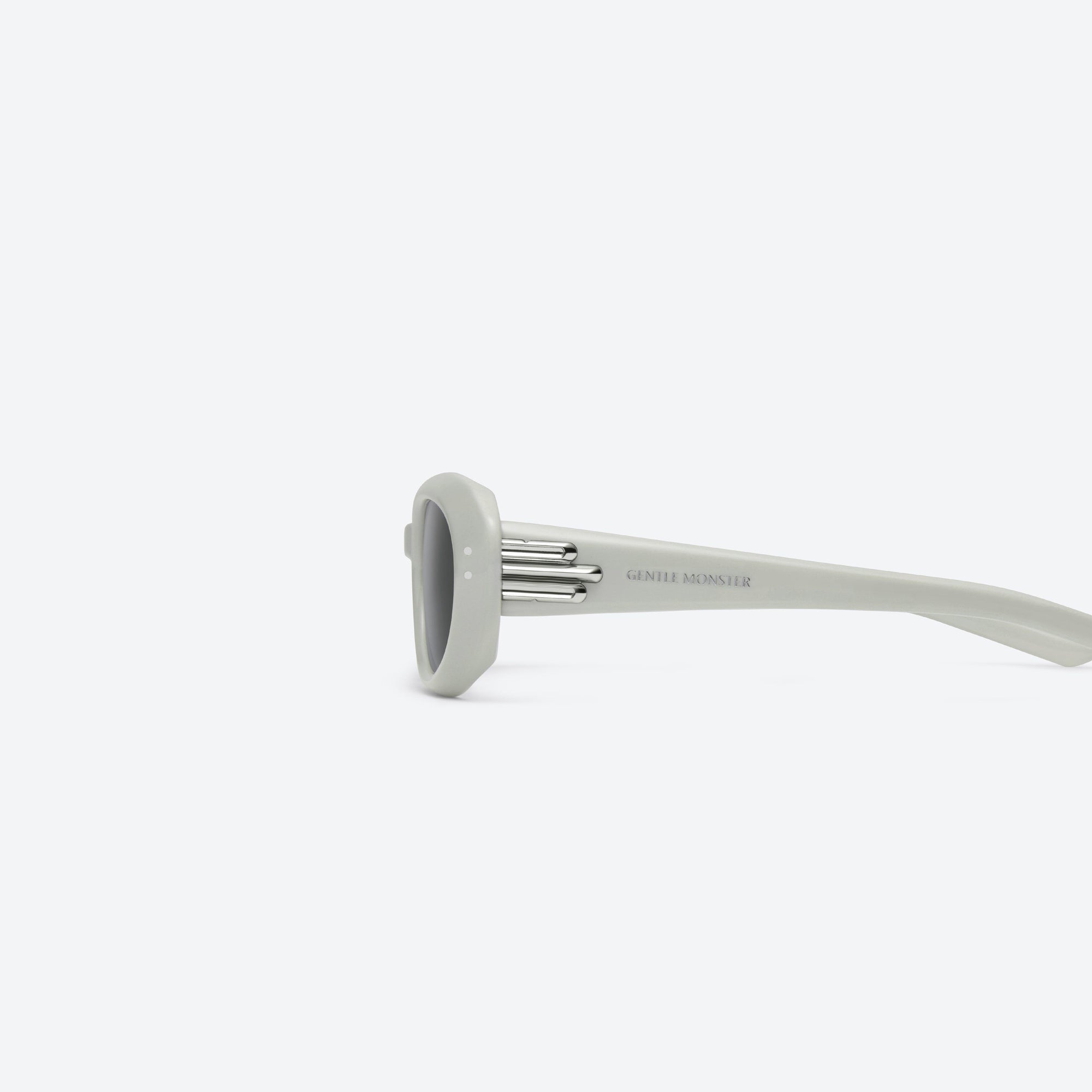 A detailed left view of Gentle Monster Blanc G12 Gray Acetate framed Oval sunglasses.