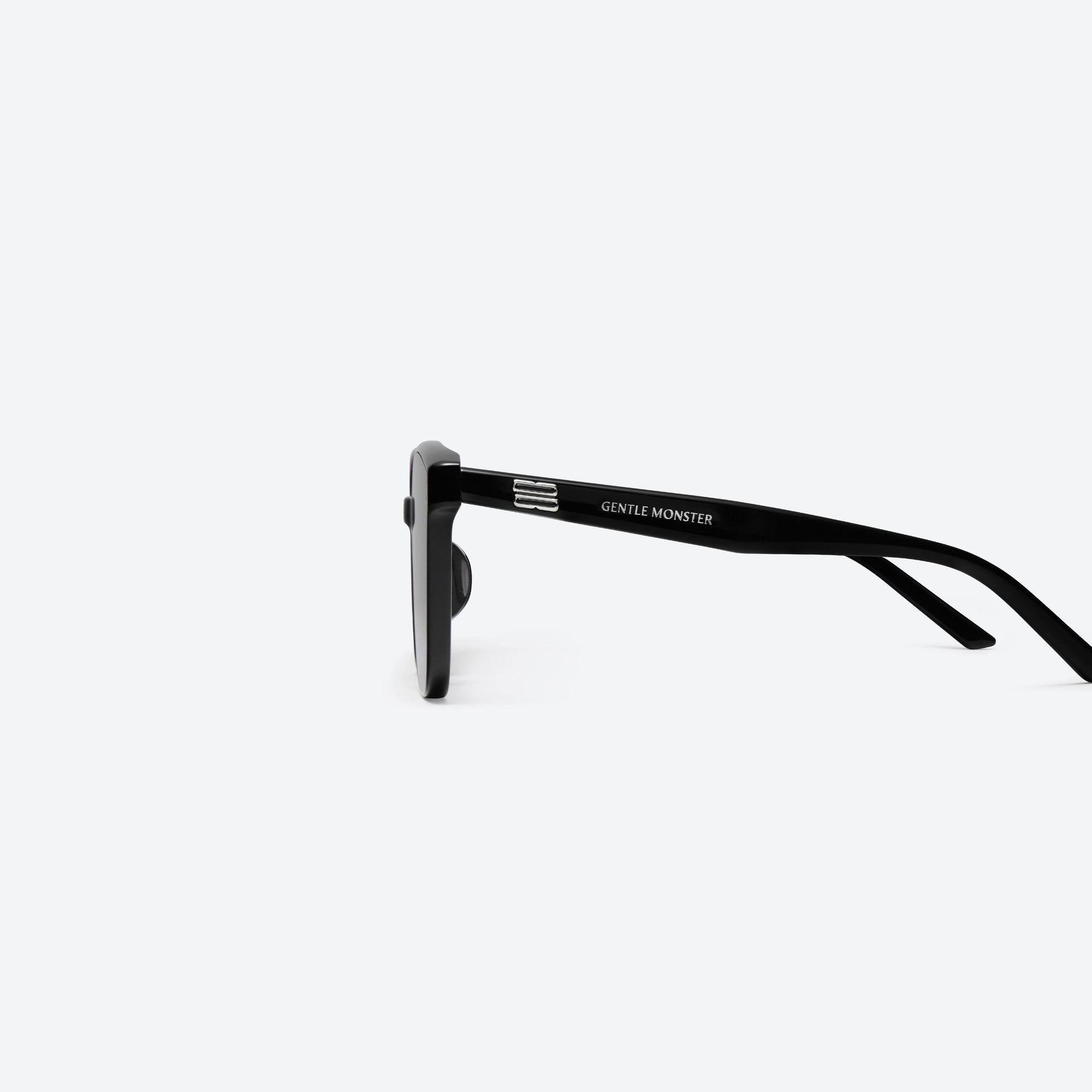 A detailed left view of Gentle Monster By 01 Black Acetate framed Square sunglasses.