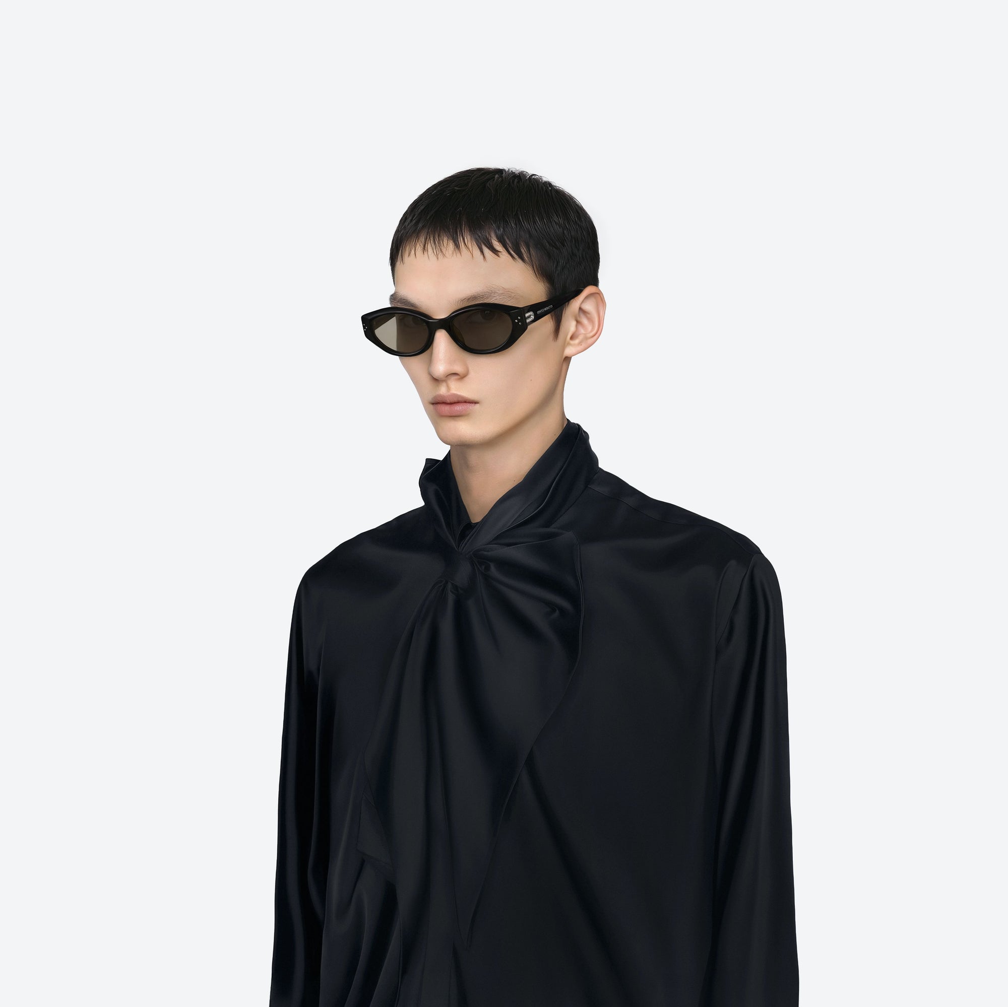Model wearing the Dada 01(G) Black Acetate framed Oval sunglasses.