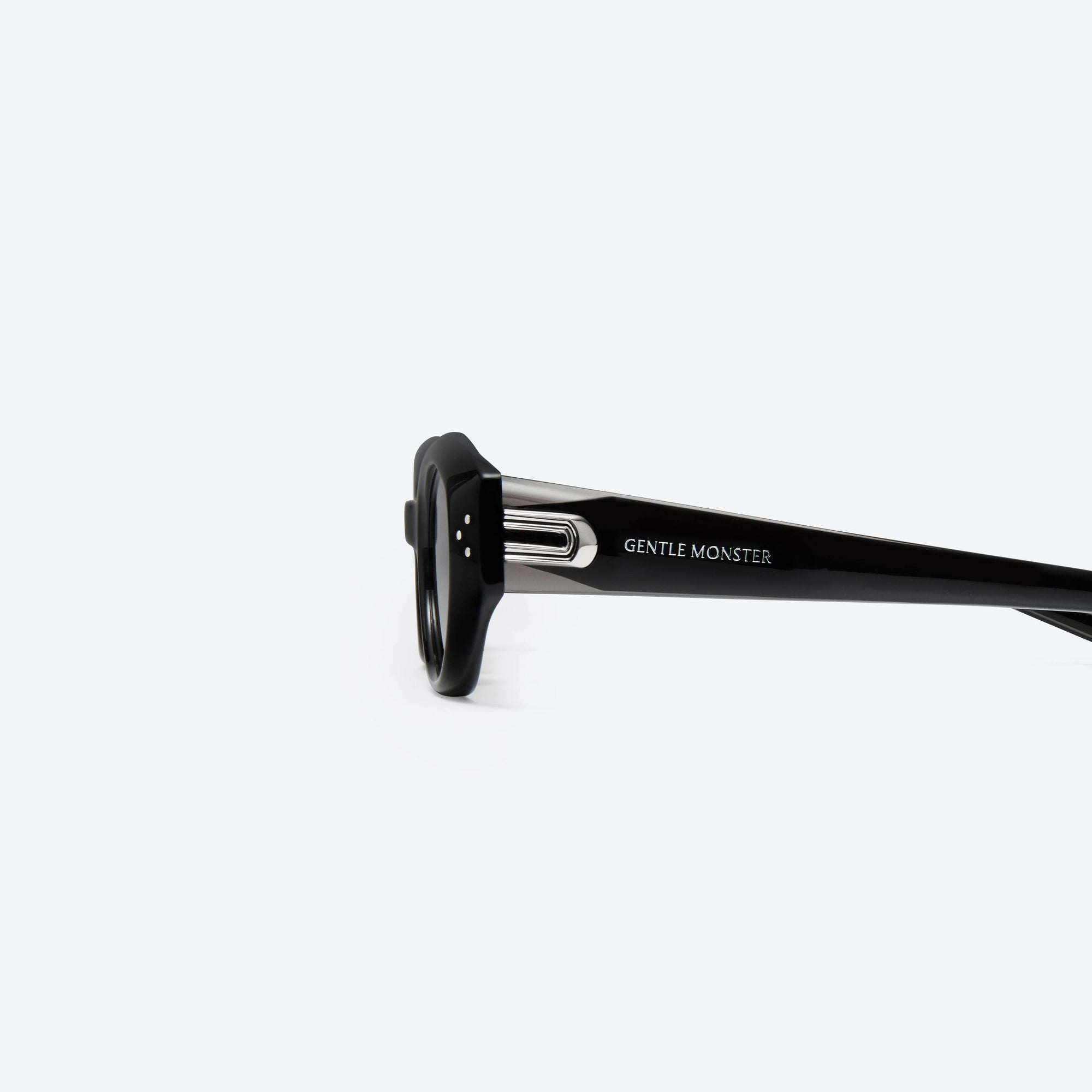 A detailed left view of Gentle Monster Dada 01(G) Black Acetate framed Oval sunglasses.
