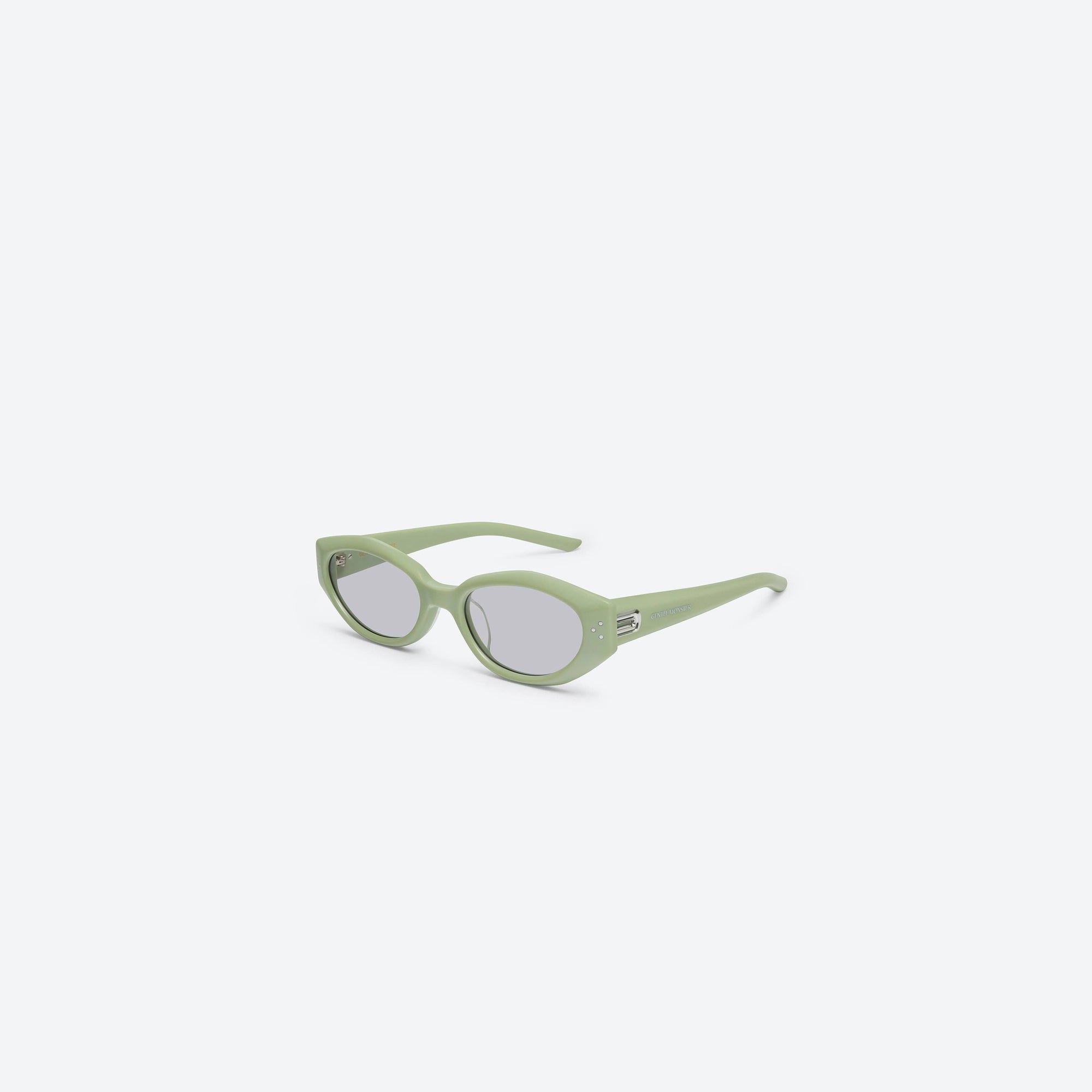 45-degree view of Gentle Monster Dada GR8 Green Acetate framed Oval sunglasses.