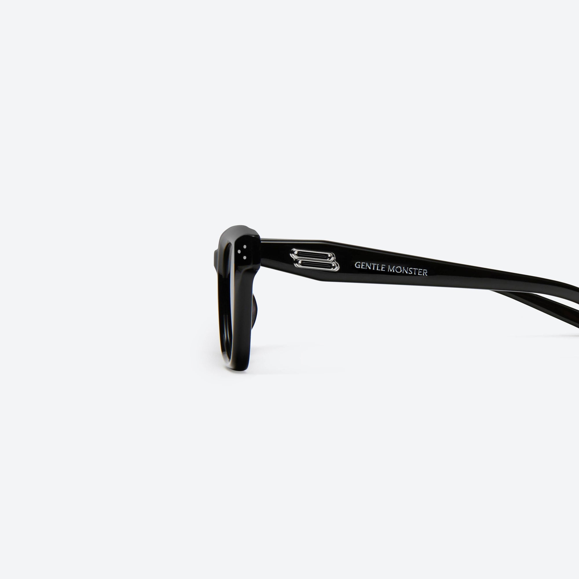 A detailed left view of Gentle Monster Hovo 01 Black Acetate framed Square sunglasses.
