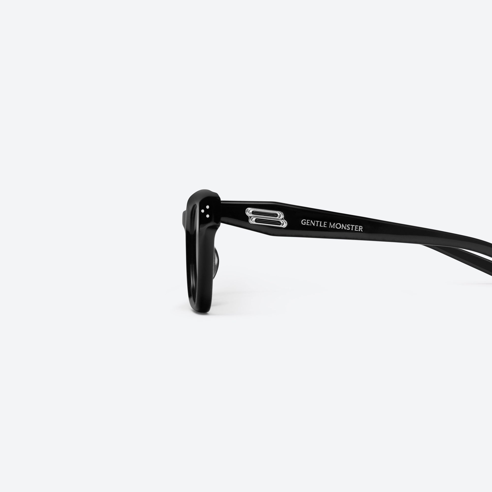 A detailed left view of Gentle Monster Hovo 01(B) Black Acetate framed Square sunglasses.