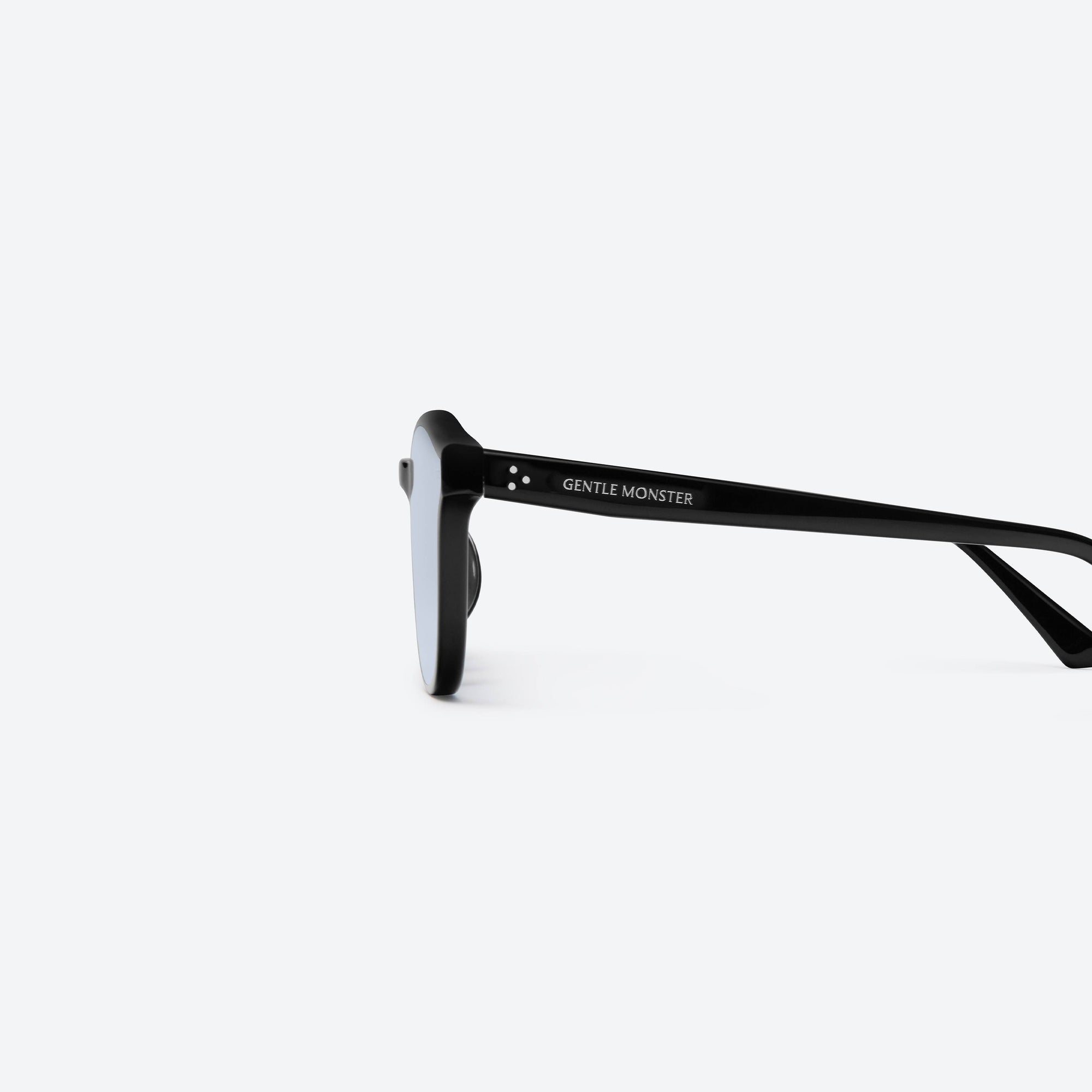 A detailed left view of Gentle Monster Jade 01(B) Black Acetate framed Round sunglasses.