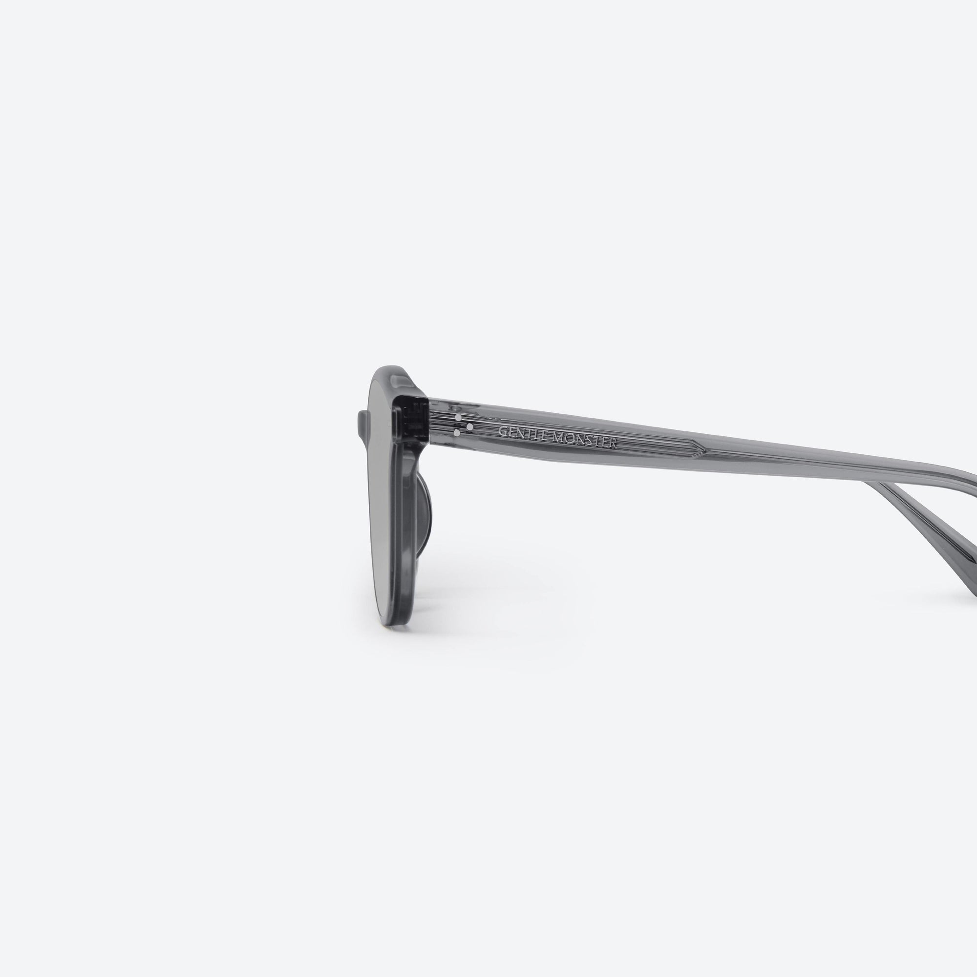 A detailed left view of Gentle Monster Jade G1 Gray Acetate framed Round sunglasses.