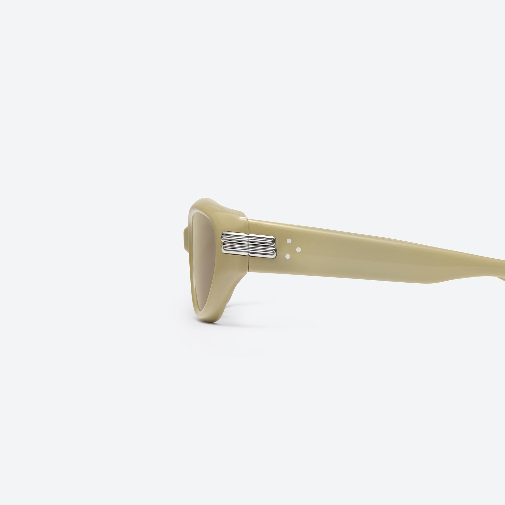 A detailed left view of Gentle Monster Kiko Y10 Yellow Acetate framed Wraparound sunglasses.