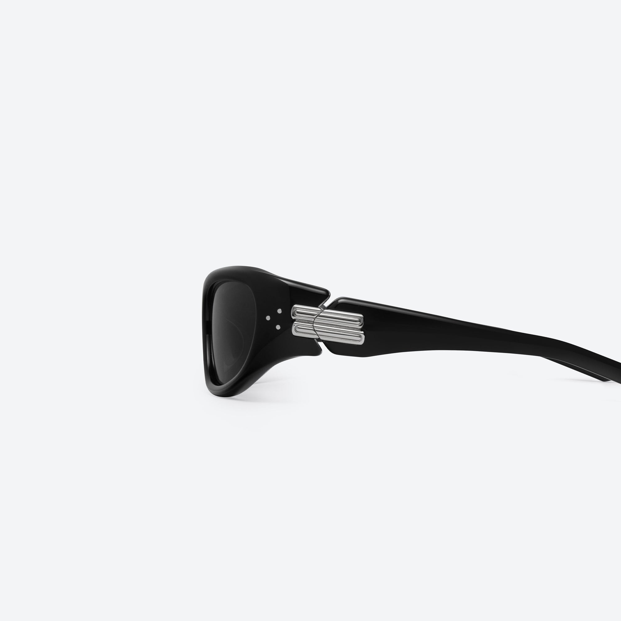 A detailed left view of Gentle Monster Memento 01 Black Mixed framed Wraparound sunglasses.